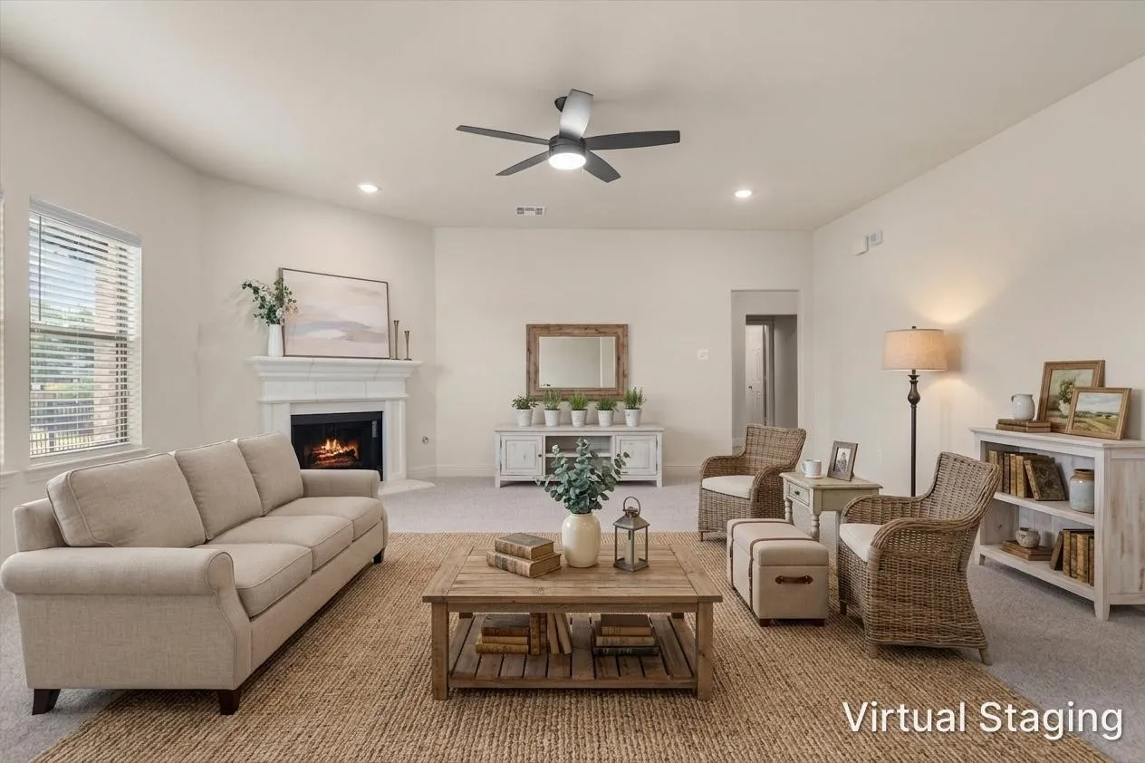 Living room styled with comfortable seating around the fireplace