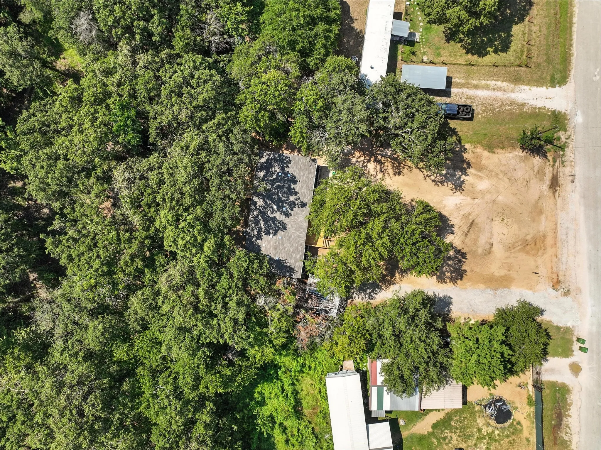 Expansive rural setting with mature tree coverage