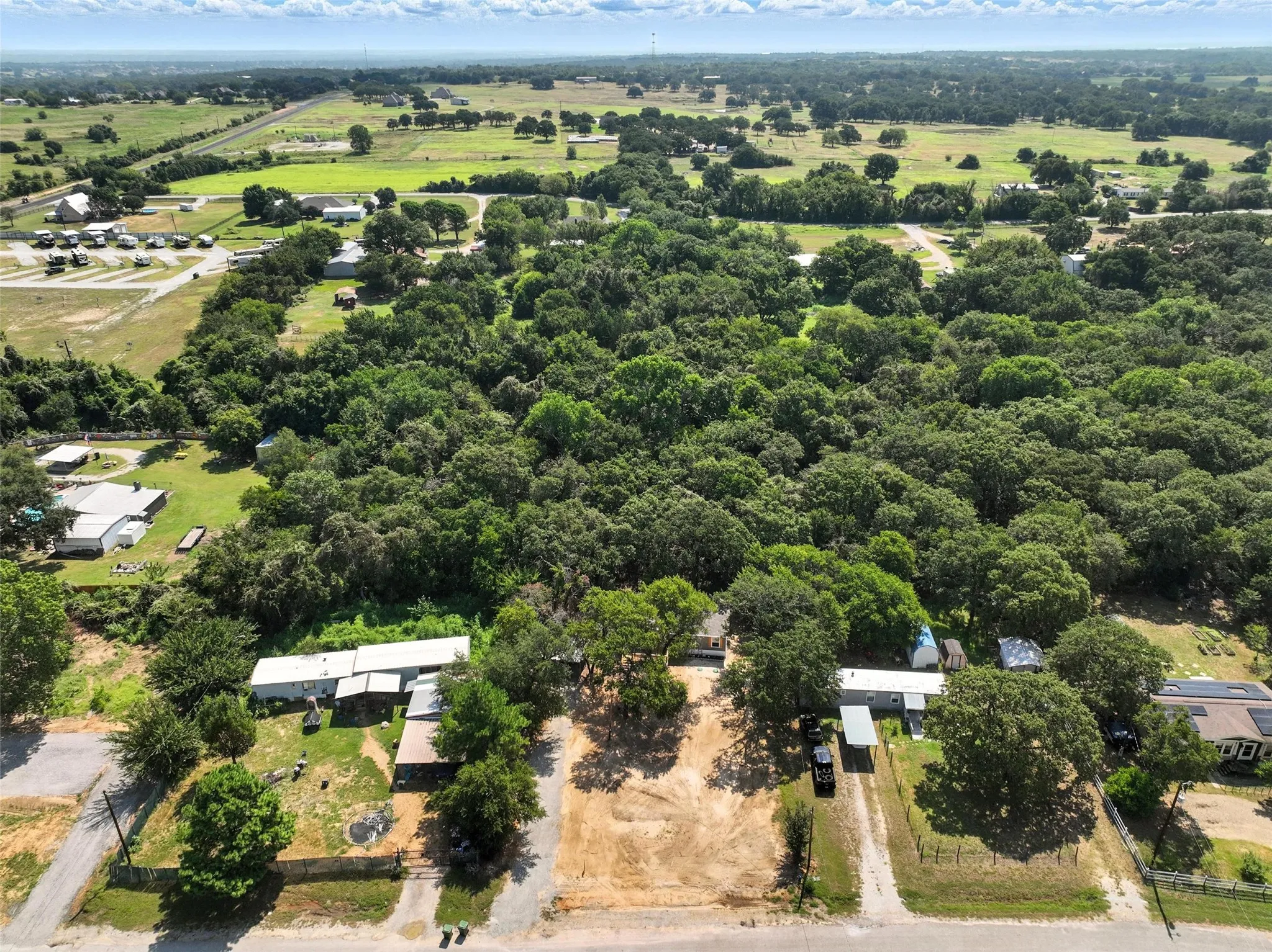 Expansive rural setting with mature tree coverage