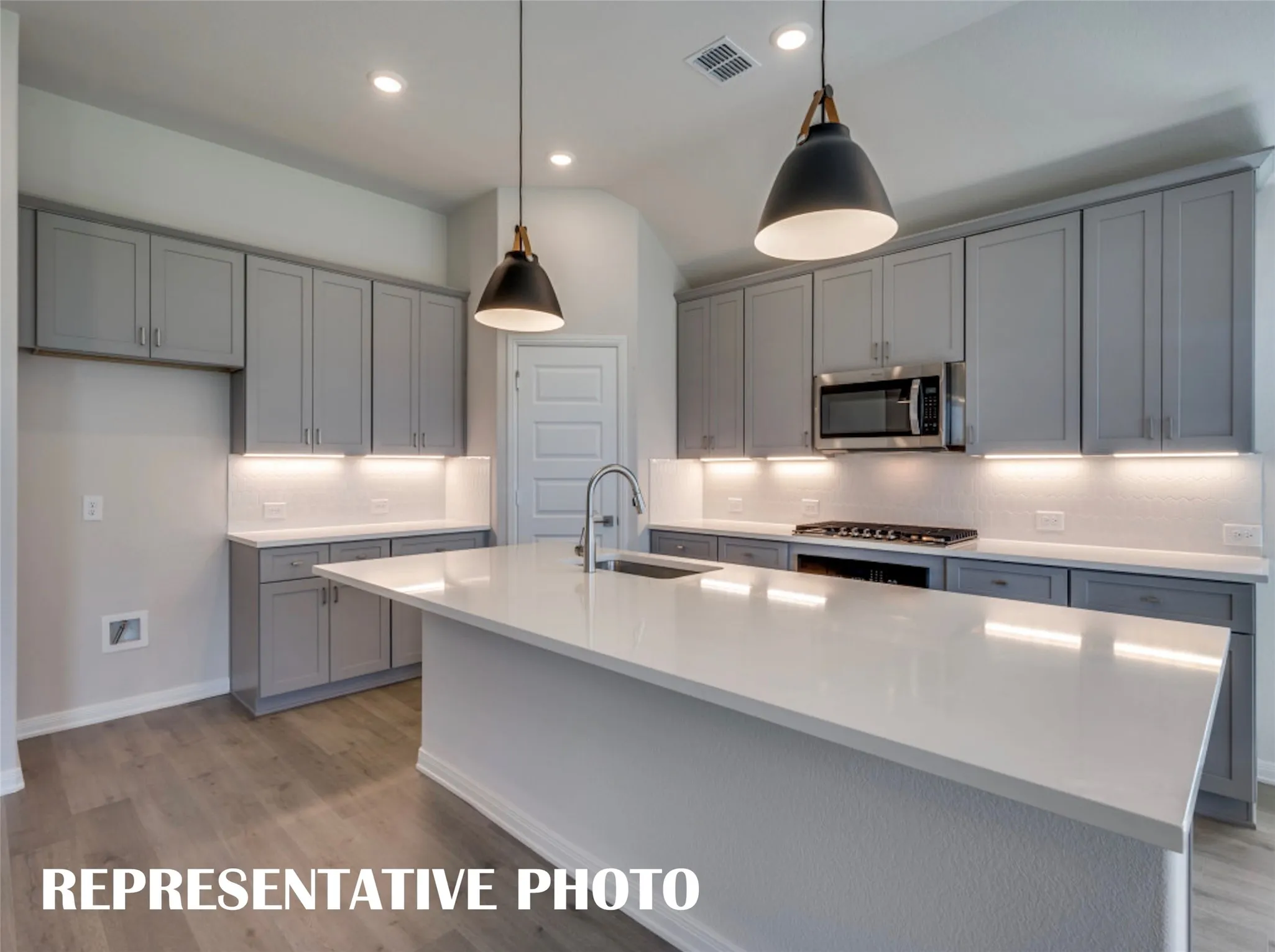 You'll find ample storage and prep space in this thoughtfully designed dream kitchen!  REPRESENTATIVE PHOTO
