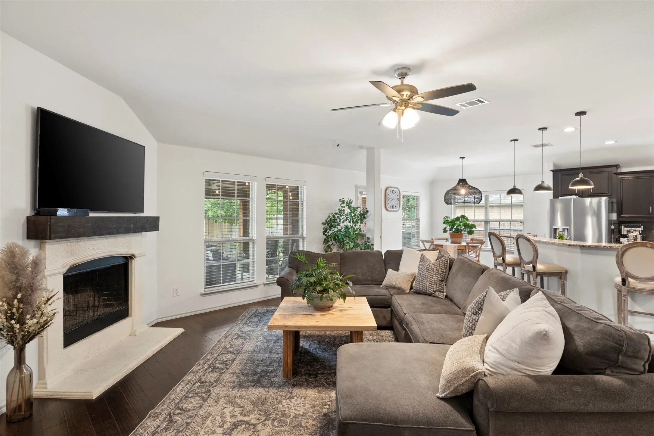 From the living room, the home's layout really comes together—kitchen, breakfast area and main living space remain open and connected without sacrificing clearly defined spaces.