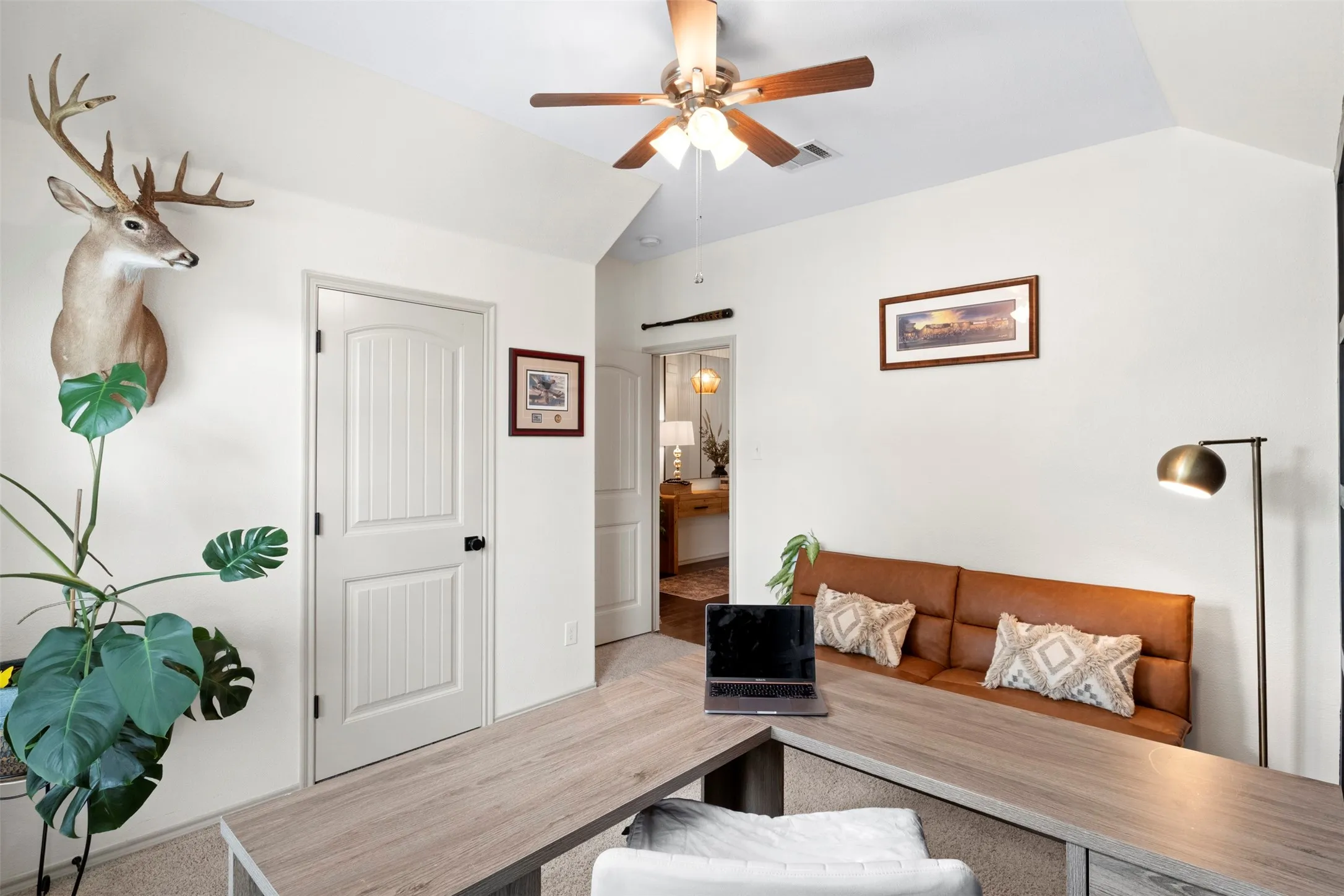 Another view of the third bedroom highlights the vaulted ceiling and spacious layout.