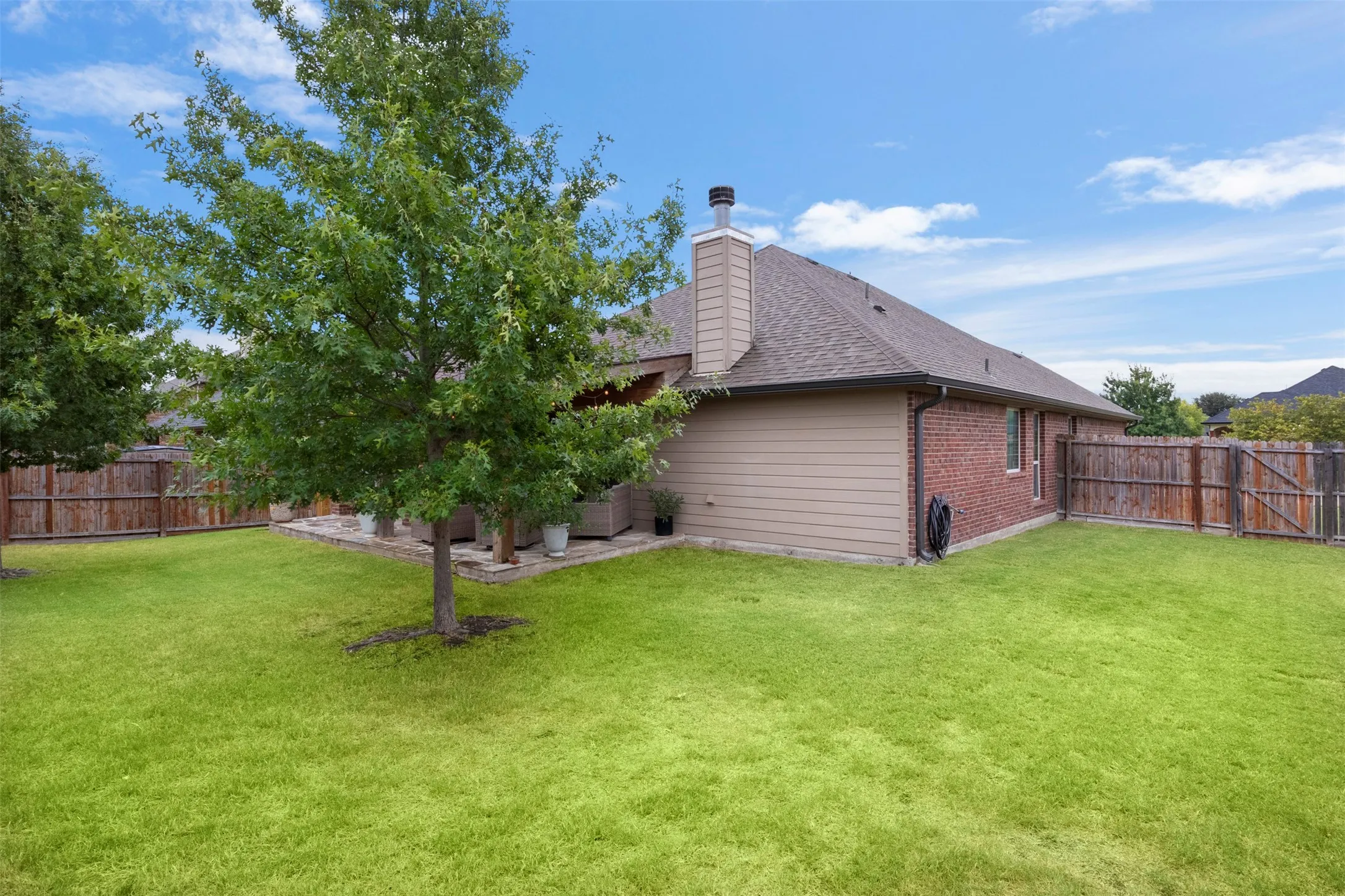 Another view shows the amount of usable yard space surrounding the home.