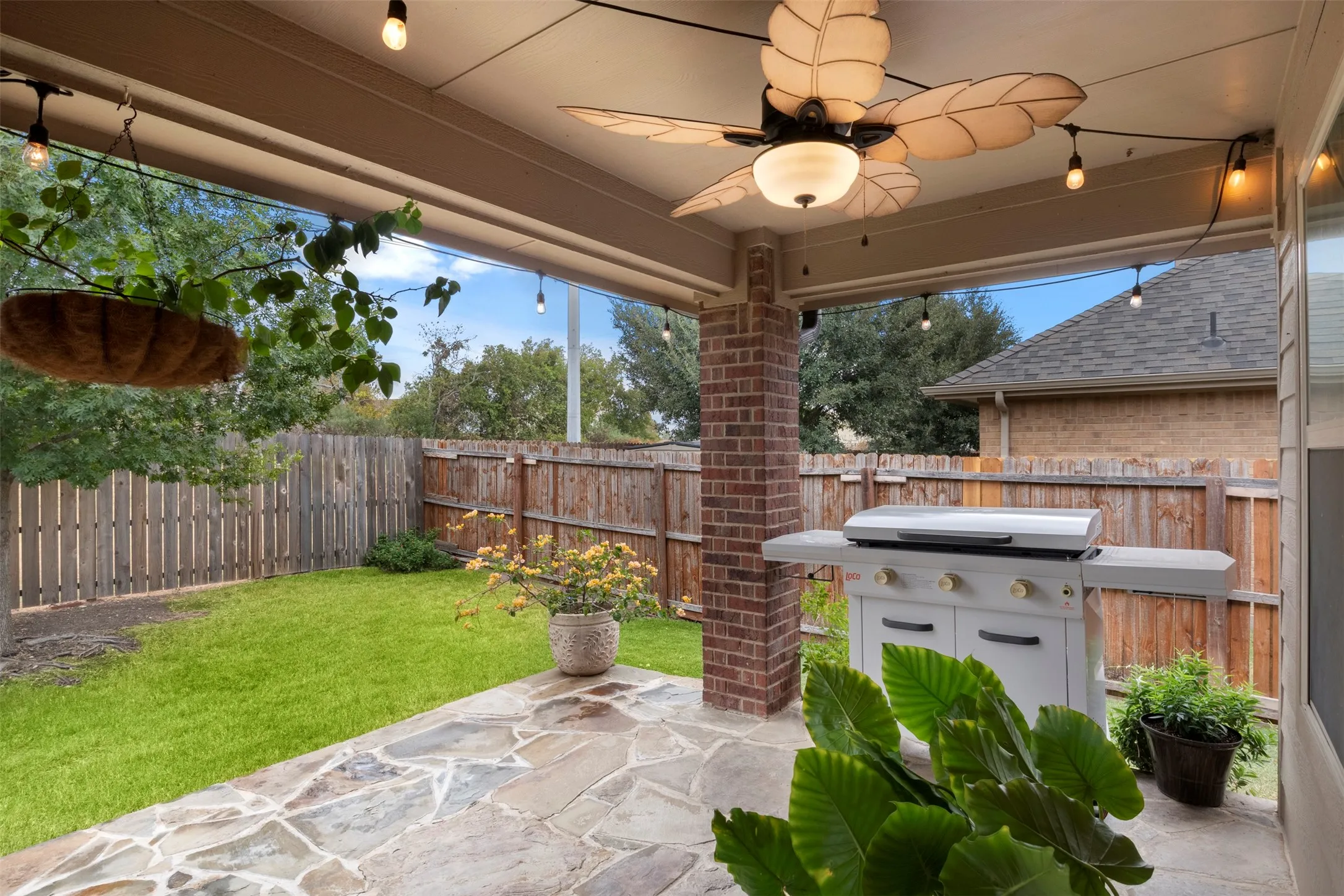 A closer look at the covered patio highlights the generous entertaining space and easy connection to the backyard.