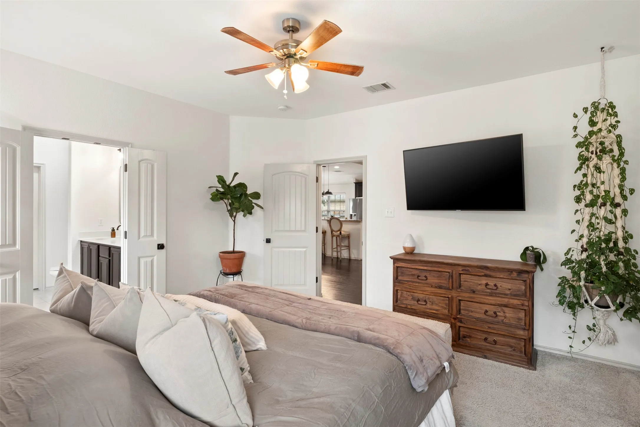 A second angle highlights the generous proportions of the primary bedroom, with plenty of room for substantial bedroom furniture without feeling crowded.