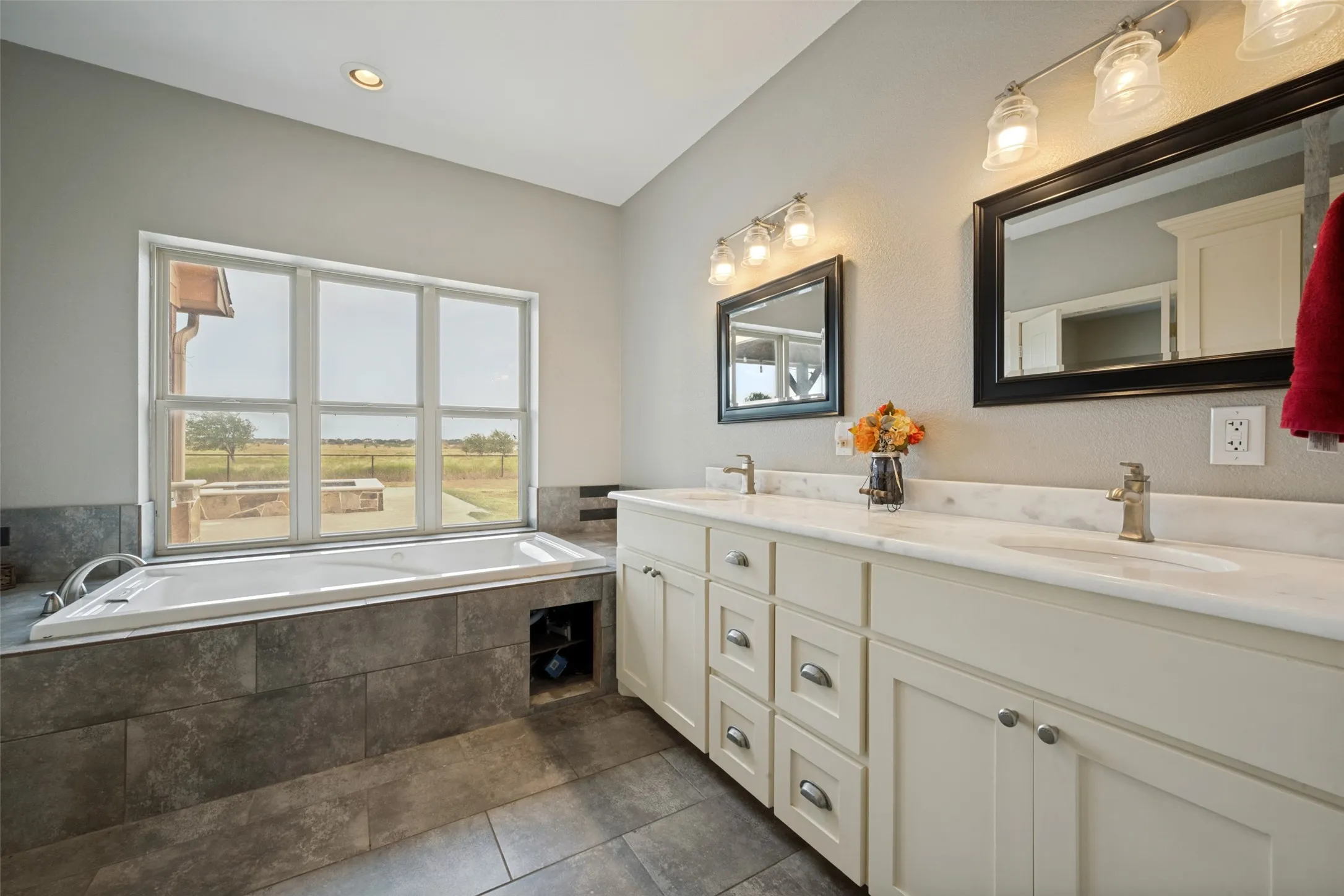 Dual vanity with undermount sinks and light-toned countertops