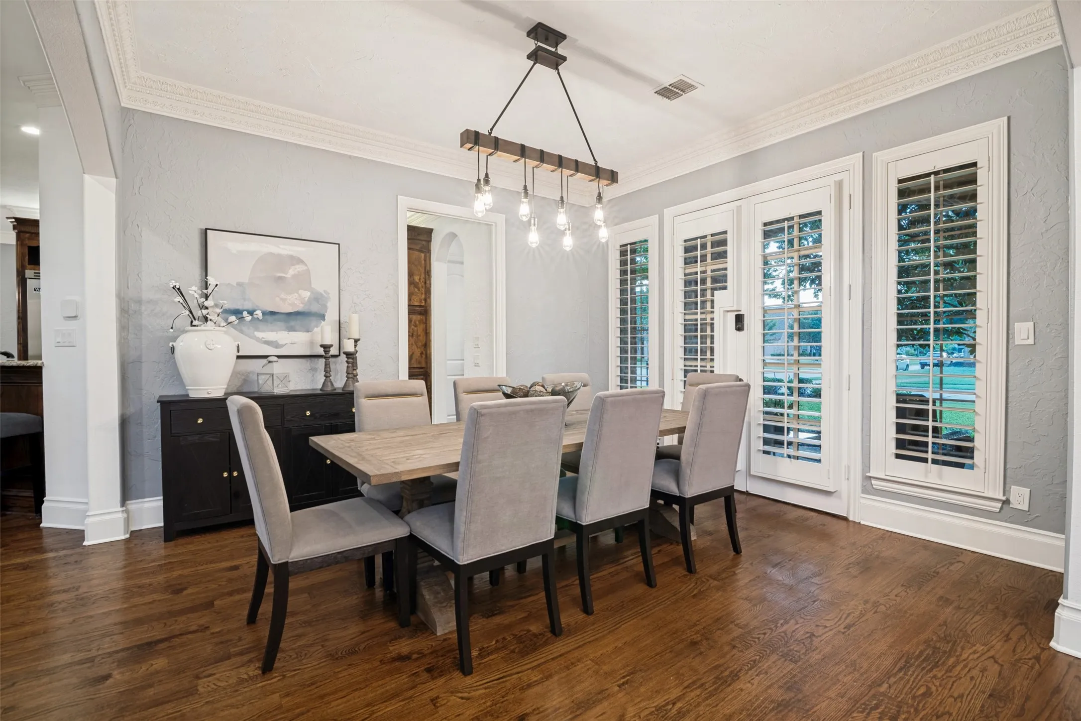 Wood-finish flooring, high-end crown molding, and plantation shutters