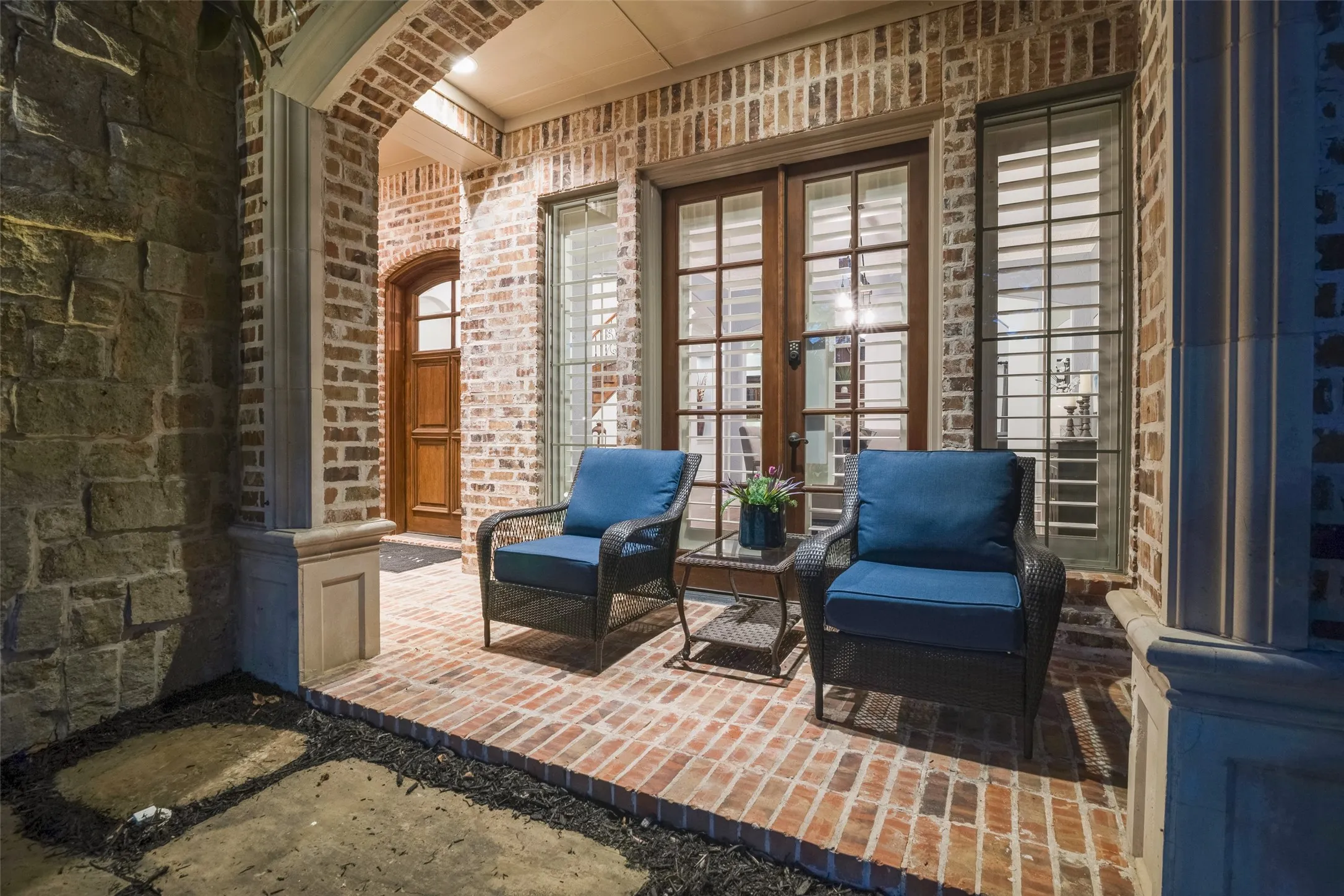 Brick exterior with stone accents and a covered porch