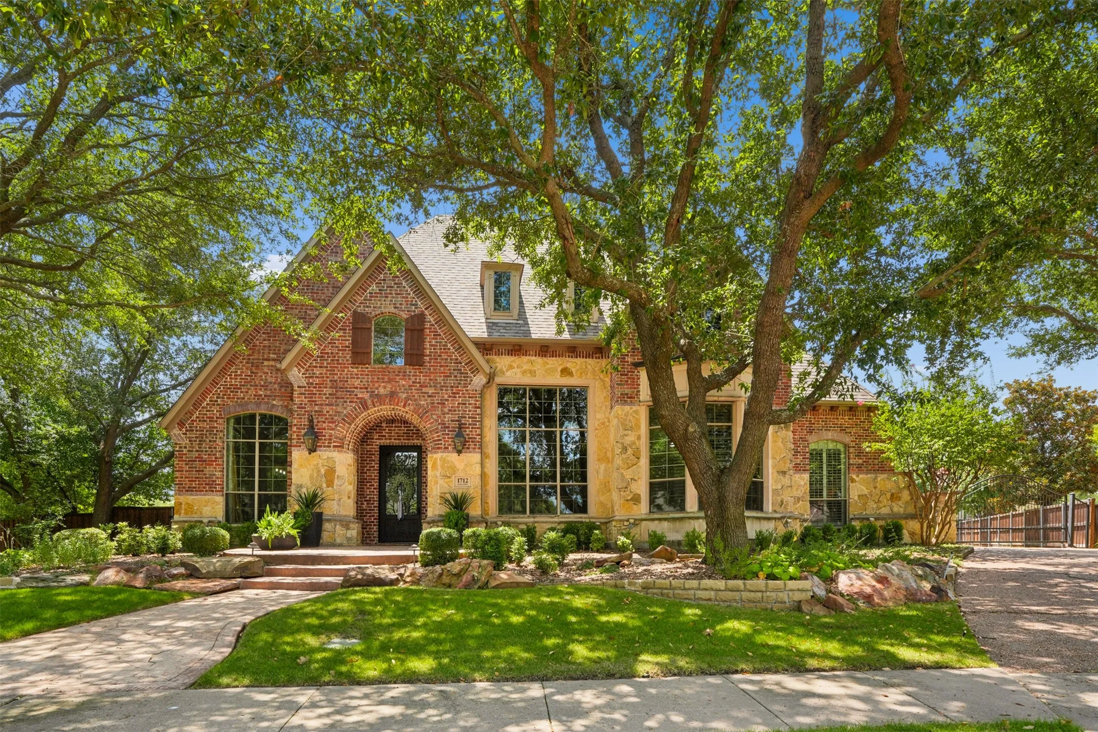 Center cul-de-sac setting, mature landscaping and timeless custom architecture create exceptional drive-up appeal.