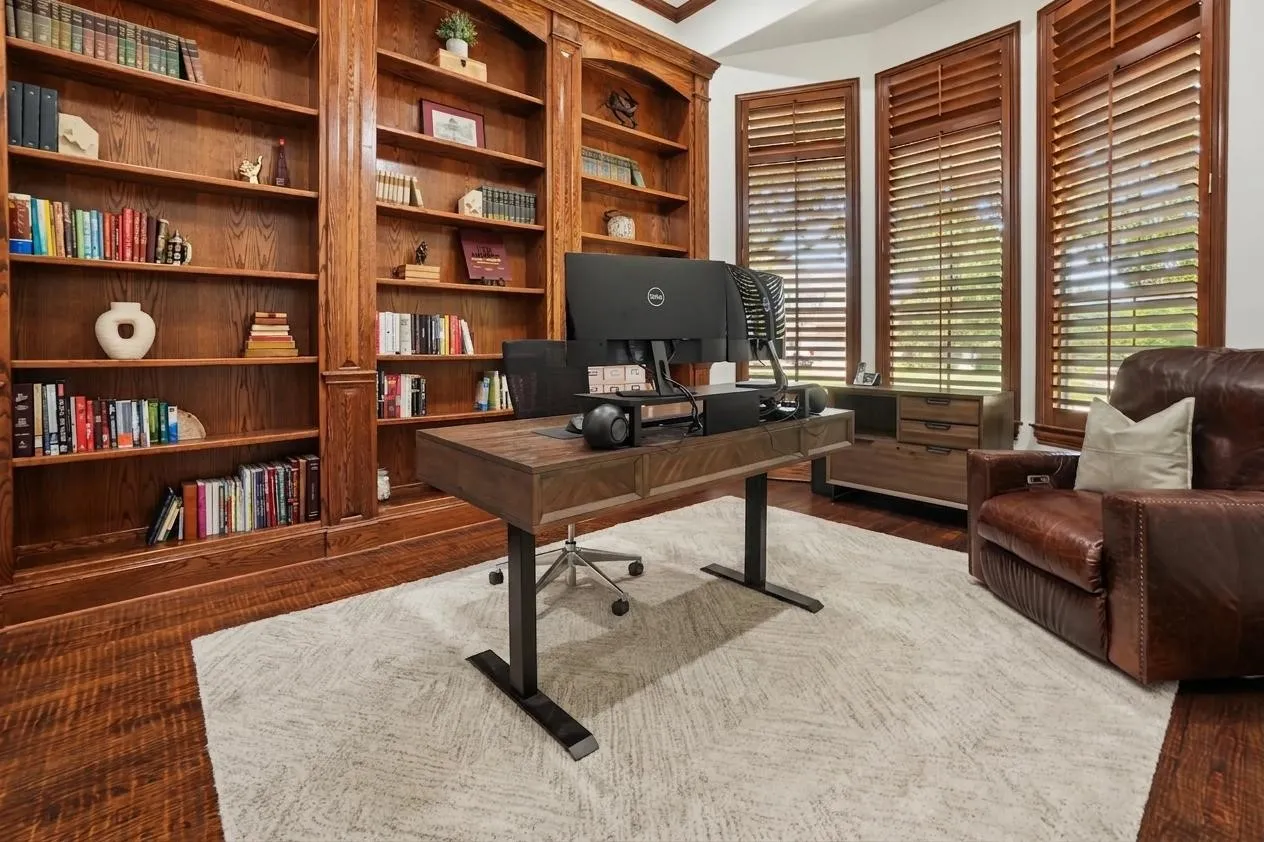 Custom cabinetry and hardwood floors give the dedicated study a polished, established feel.
