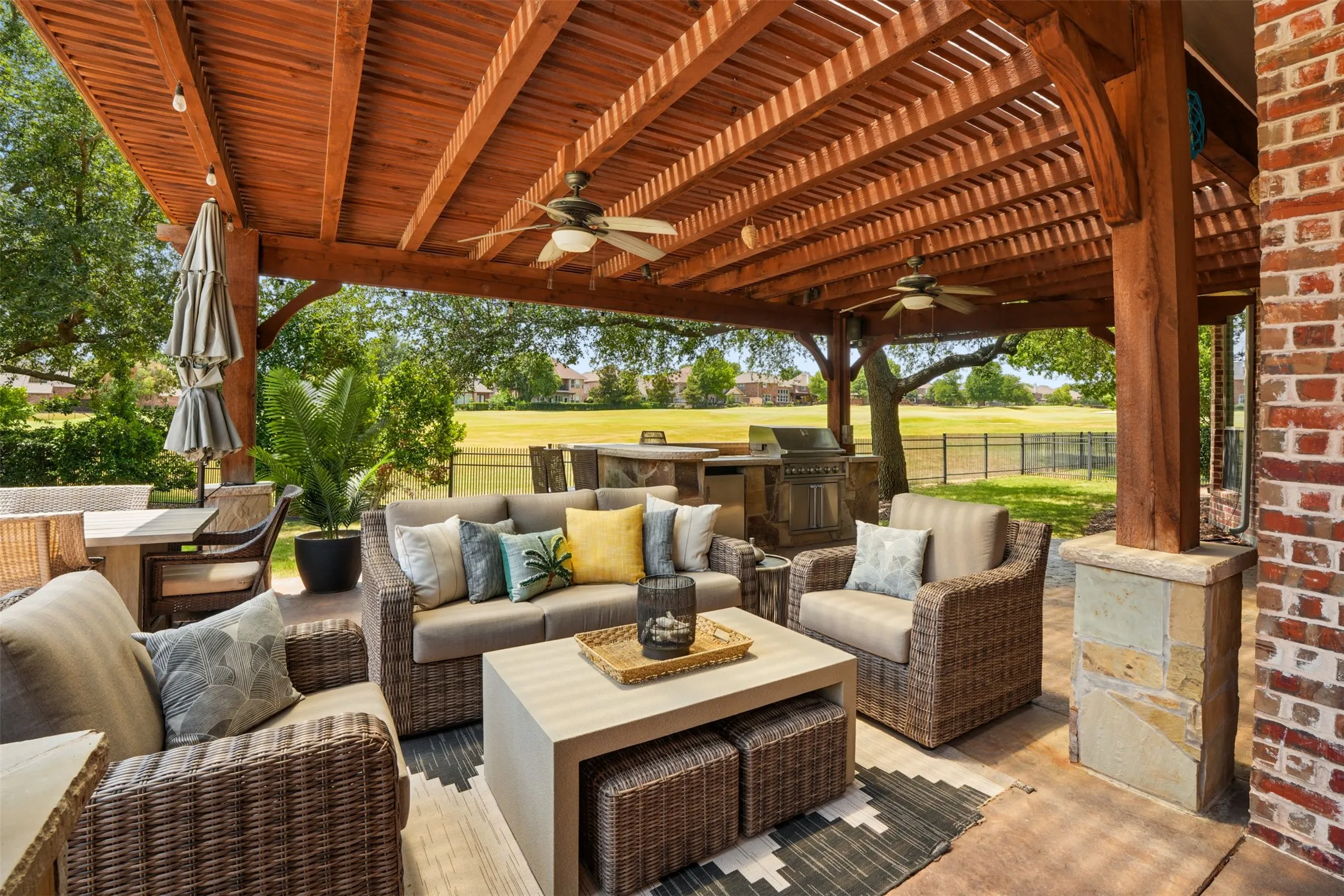Expansive backyard pergola creates a true outdoor room for dining, entertaining and relaxing.