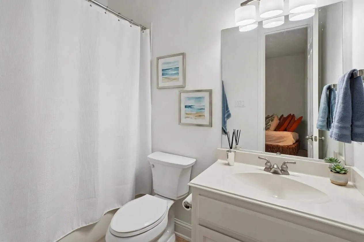Private secondary bath provides convenient en-suite access for the downstairs bedroom.