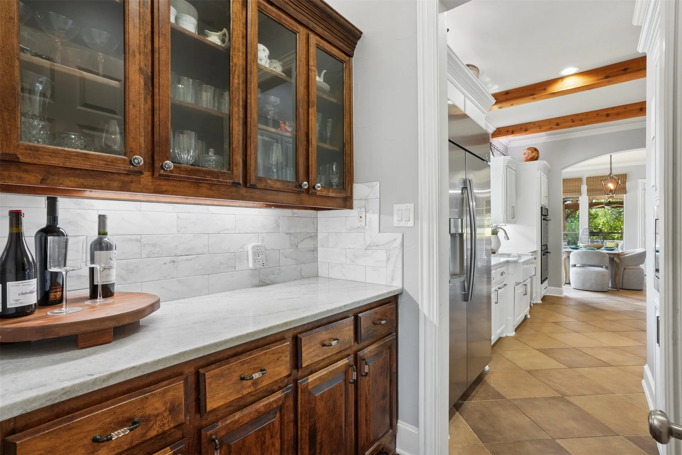 Built-in cabinetry at the butler pantry adds functional storage and a polished transition between living and entertaining spaces.