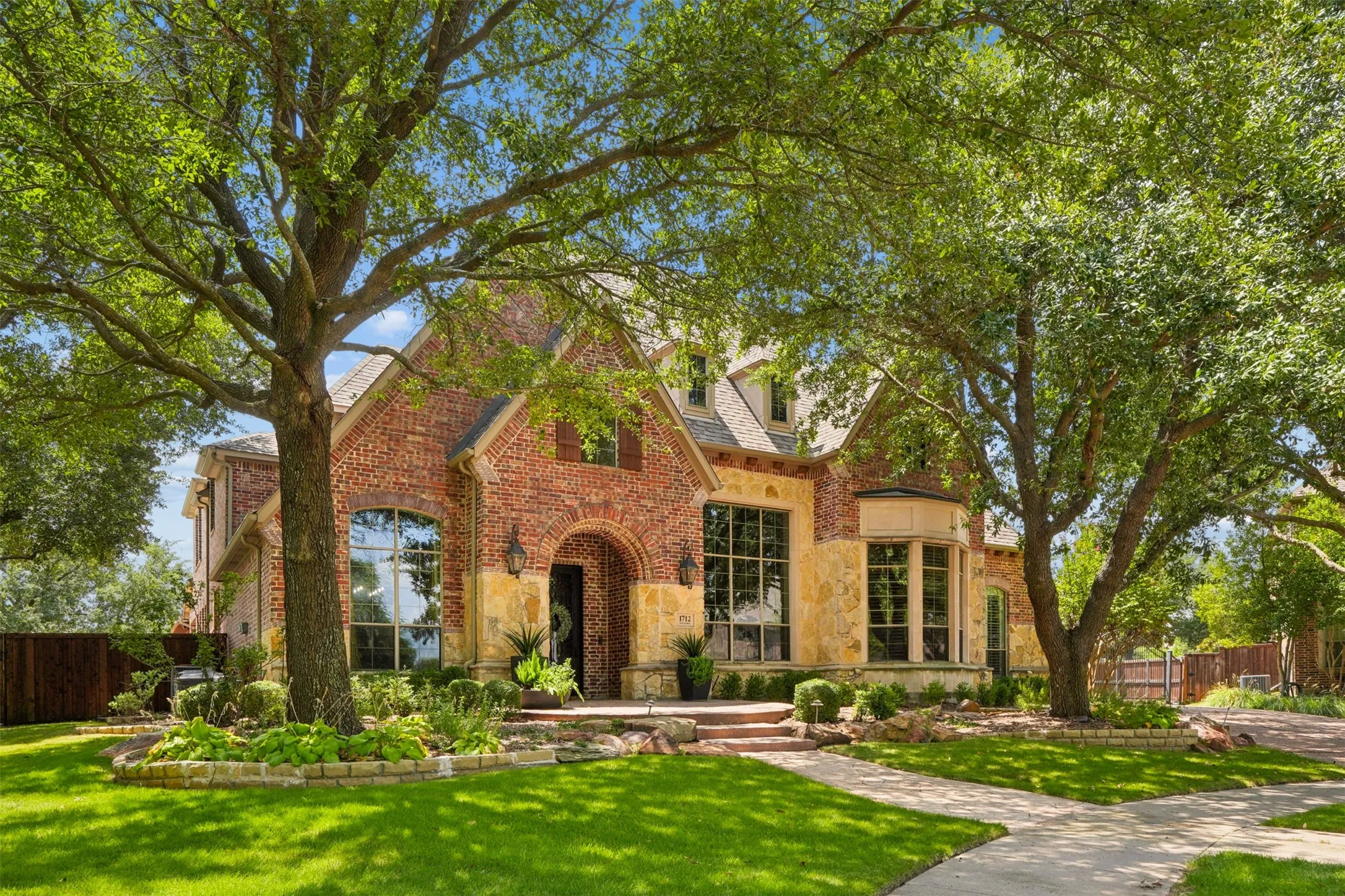 Custom Sanders home at 1712 Singletree on a half-acre cul-de-sac lot in Tanglewood of Stonebridge Ranch.