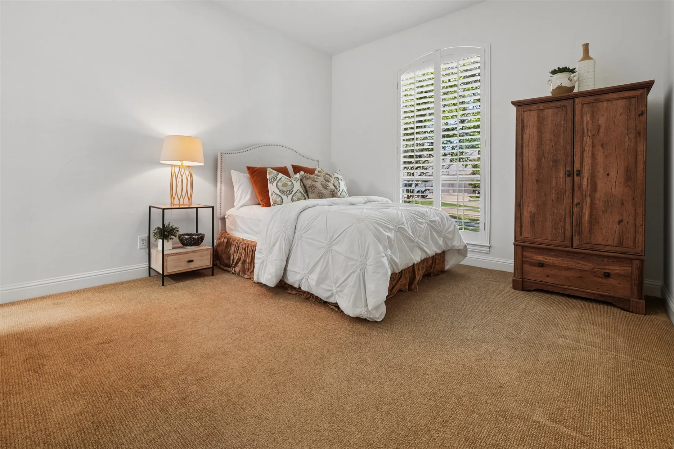Downstairs bedroom 2 provides private guest accommodations with en-suite bath access.