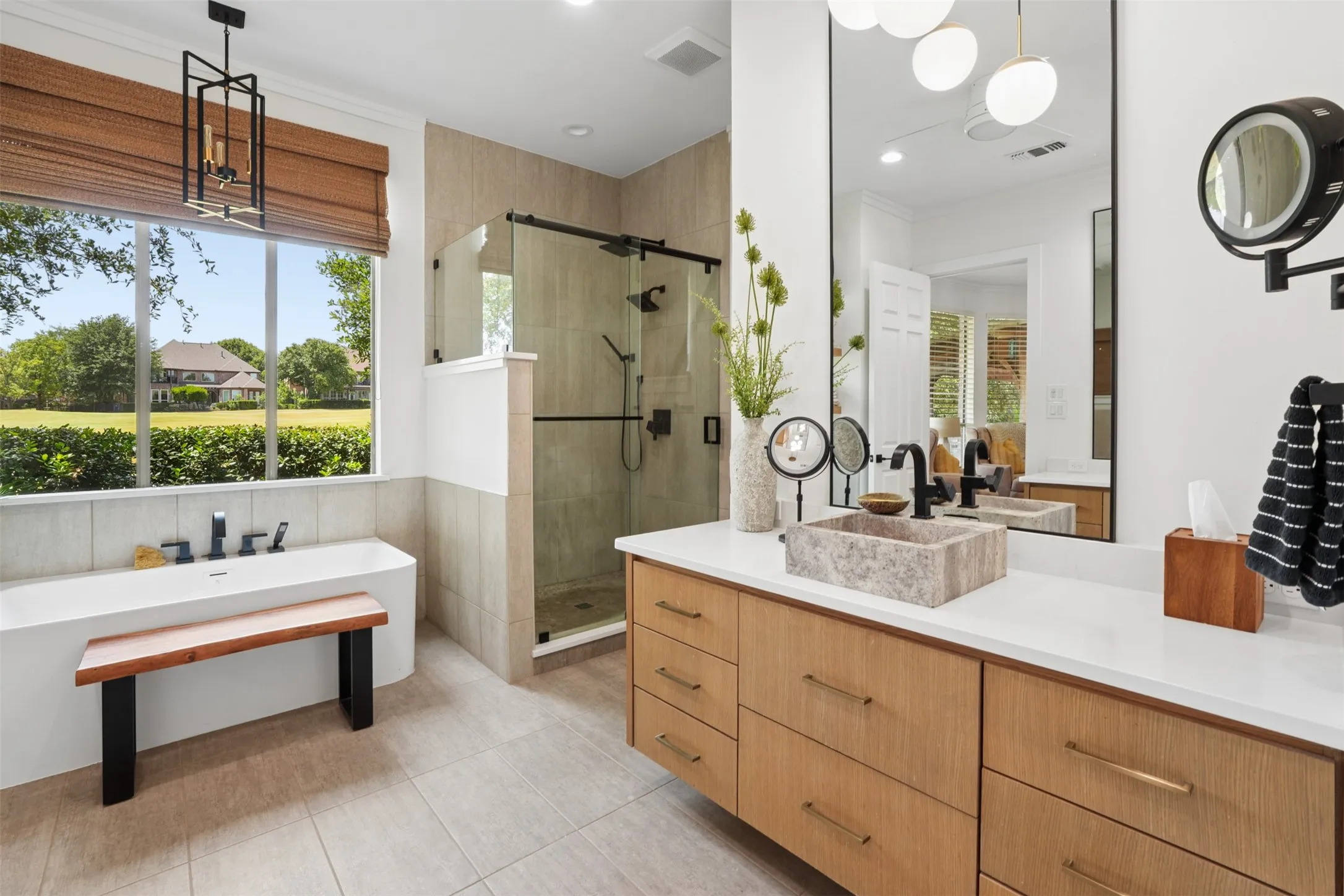 Remodeled primary bathroom offers a bright, sophisticated retreat with generous vanity space.