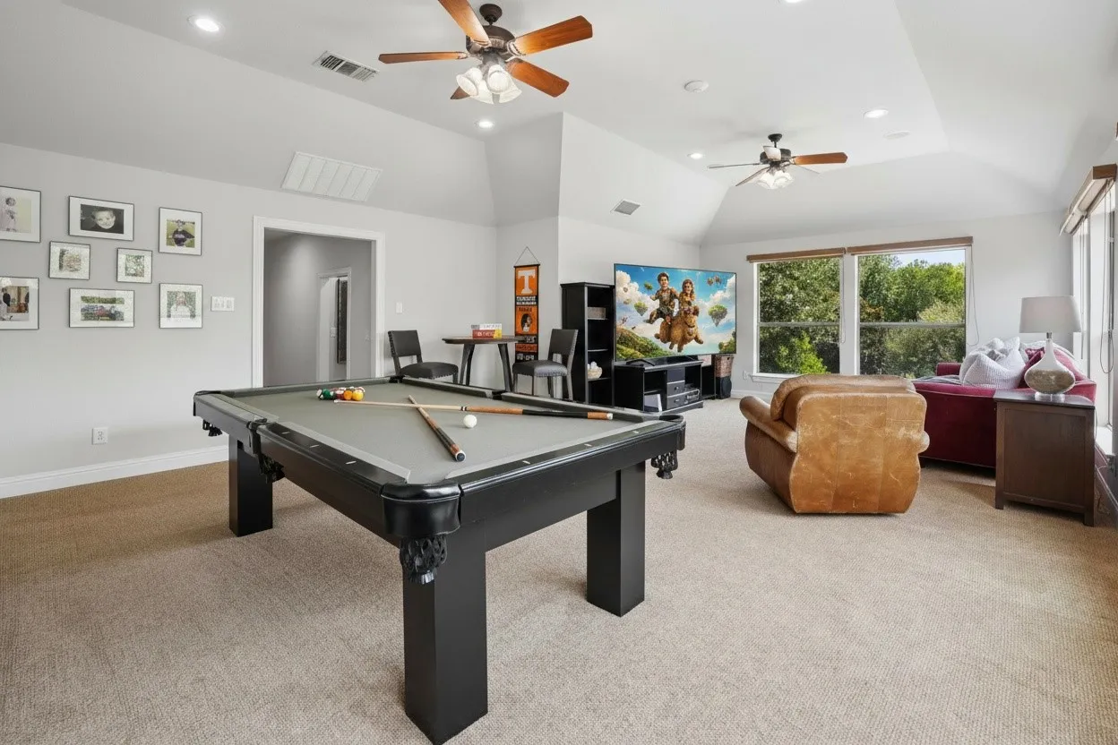 Exceptionally large upstairs game room offers space for billiards, media, play and multiple activity zones.