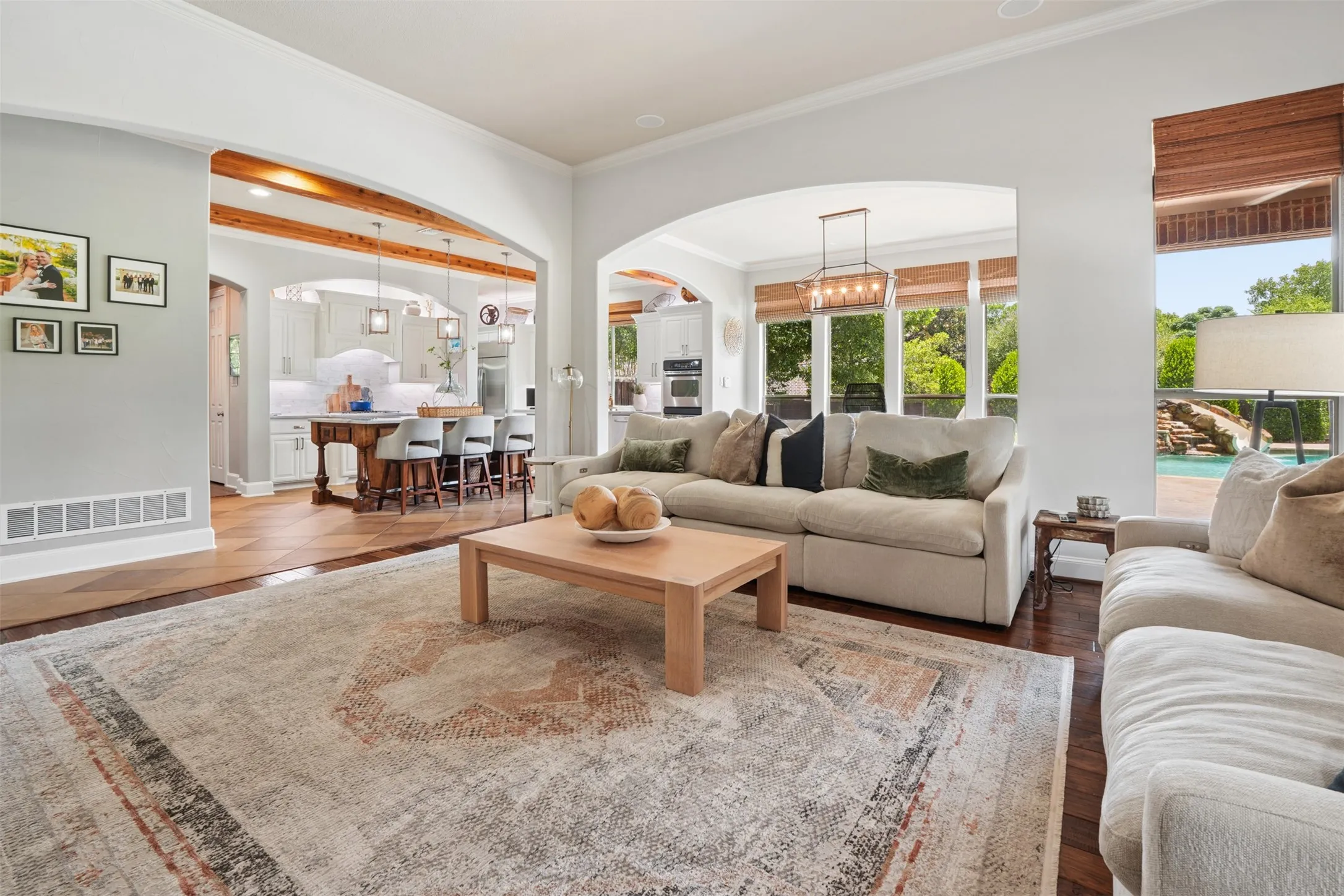 Large family room feels substantial yet comfortable, with natural light and an open connection to the kitchen.