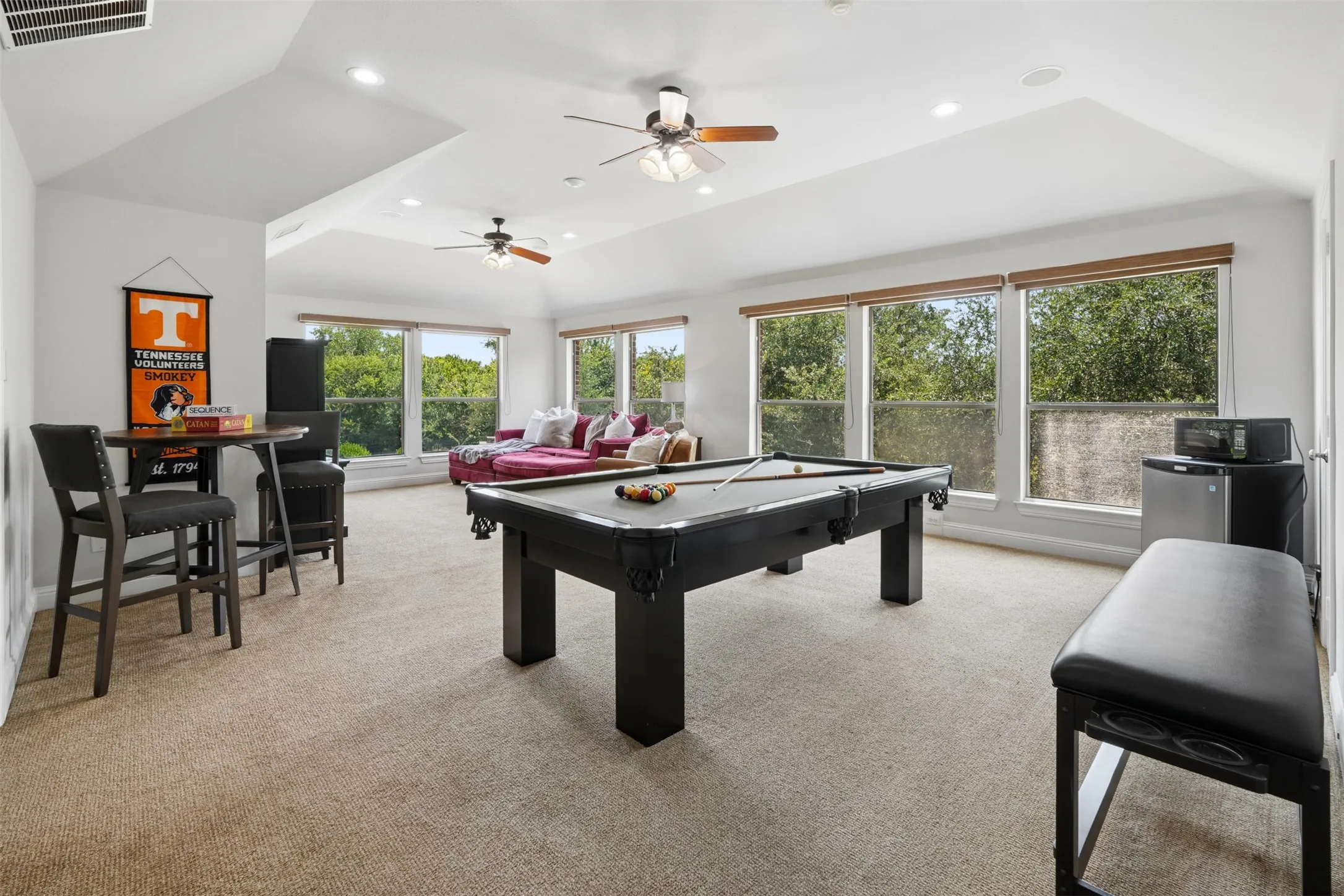 Exceptionally large upstairs game room offers space for billiards, media, play and multiple activity zones.