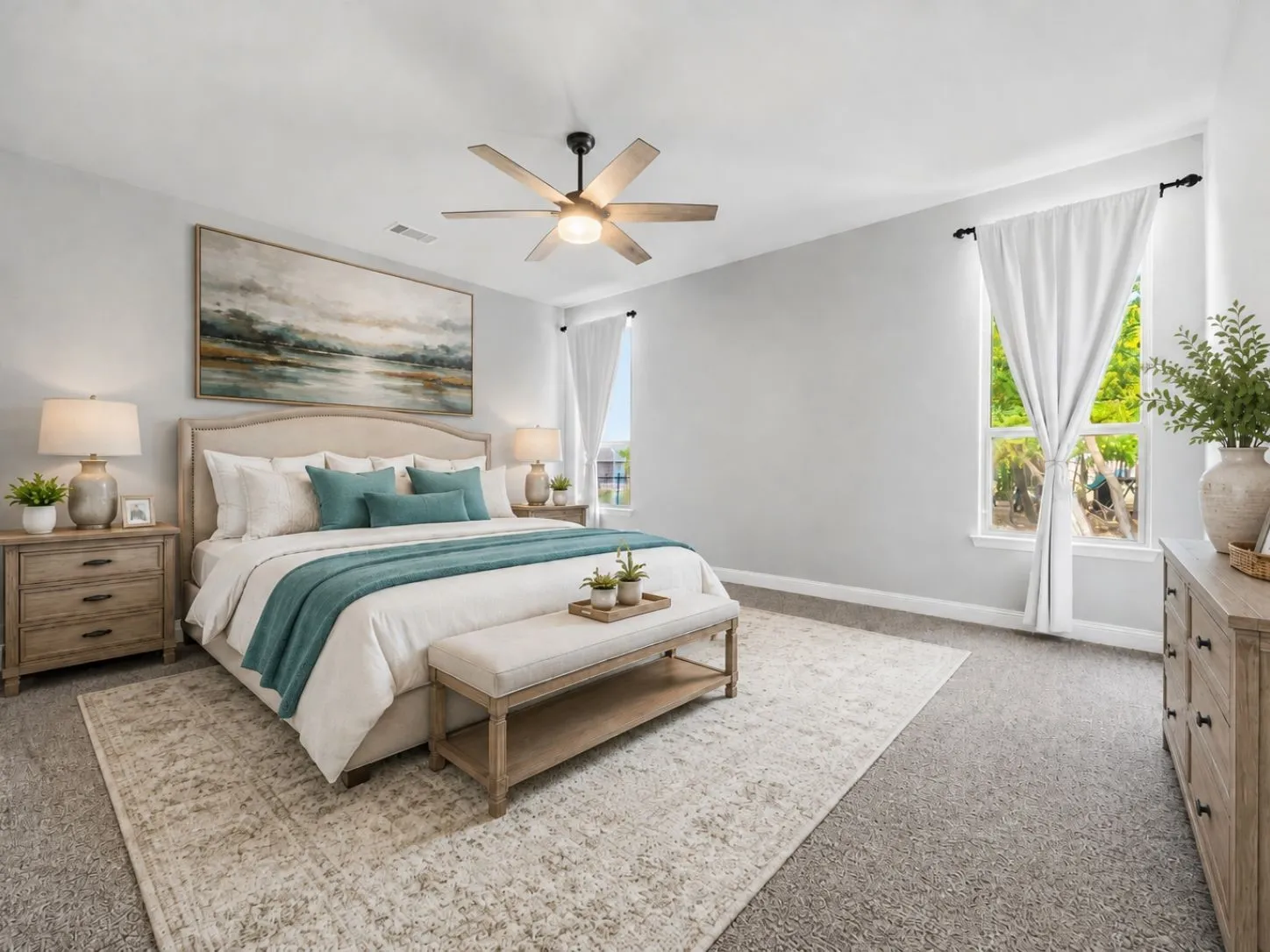 Recessed lighting, ceiling fan with integrated light, two windows with white window treatments, and carpet flooring