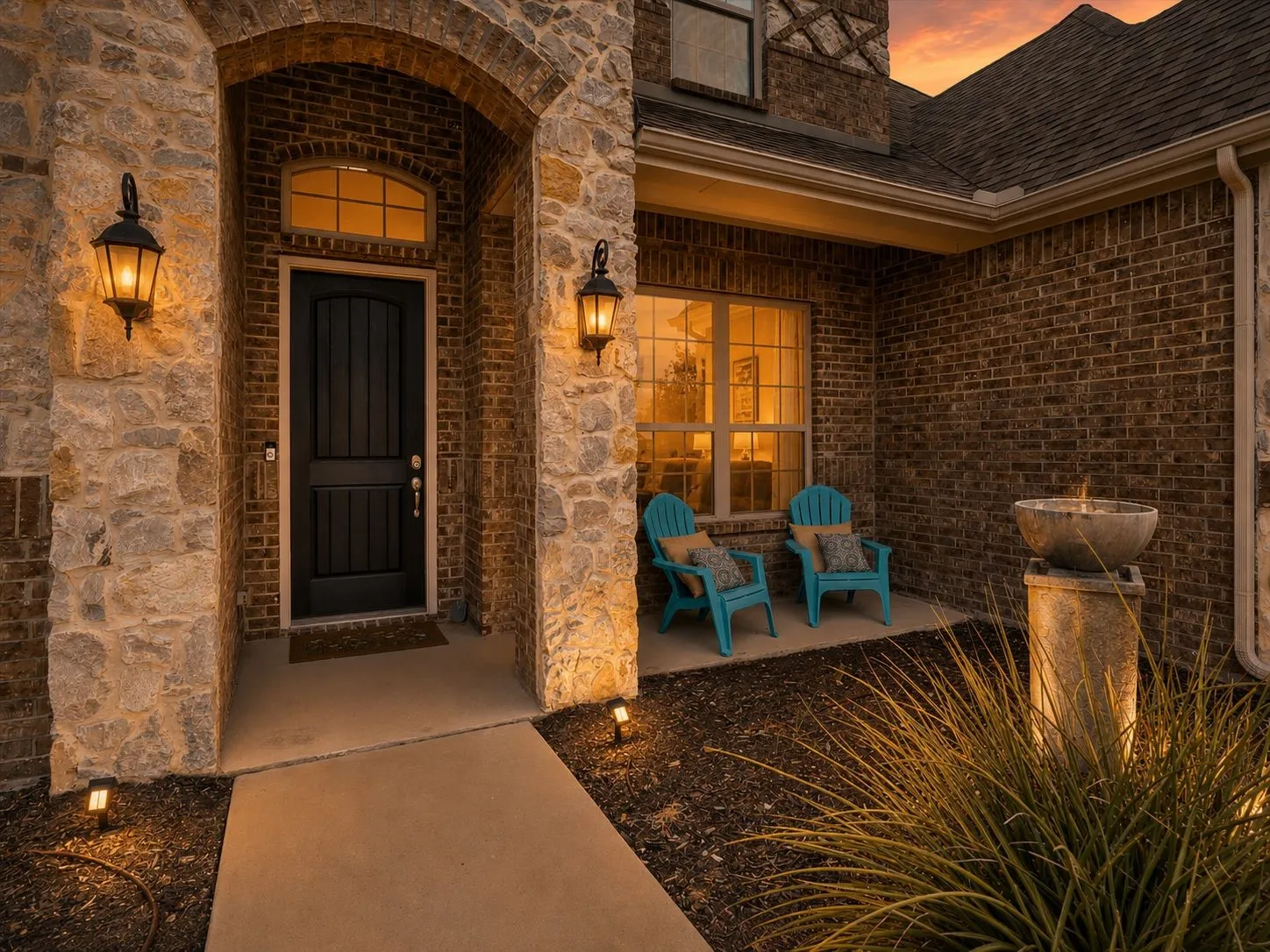 Stone and brick facade with an arched entryway