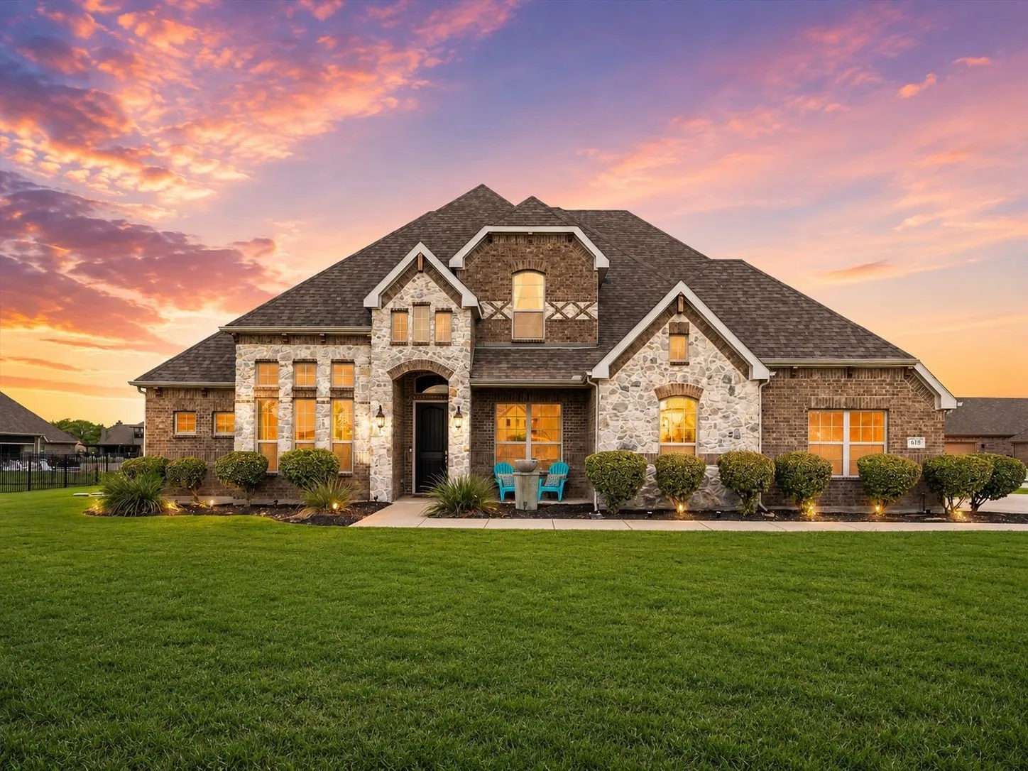 Stone and brick facade with an arched entry