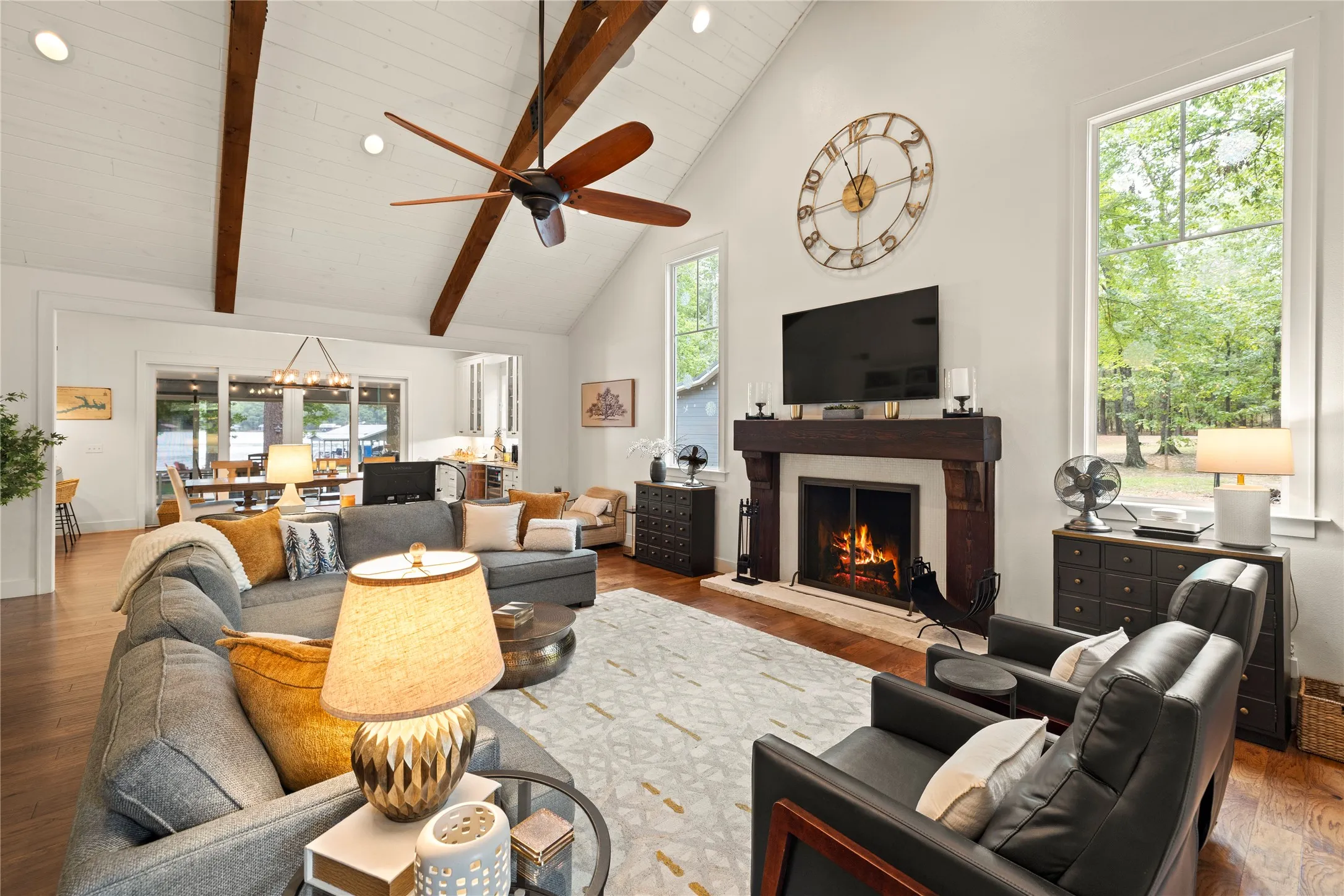 Prepare to be impressed with the cathedral beamed ceiling & the vast amount of gleaming hardwood floors + all of the fabulous natural light streaming in. A woodburning fireplace for warmth & ambiance. Surround sound speakers too.  A breath of fresh air where everyone gathers!