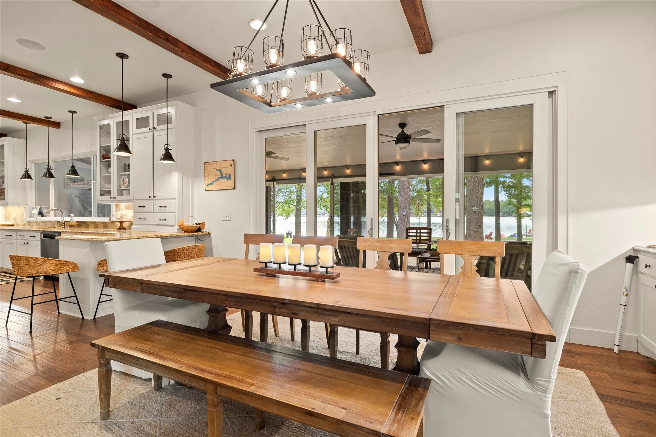 Upgraded lighting showcased here---chandelier, pendants, ceiling fans inside & out. Just bring your own dining table.