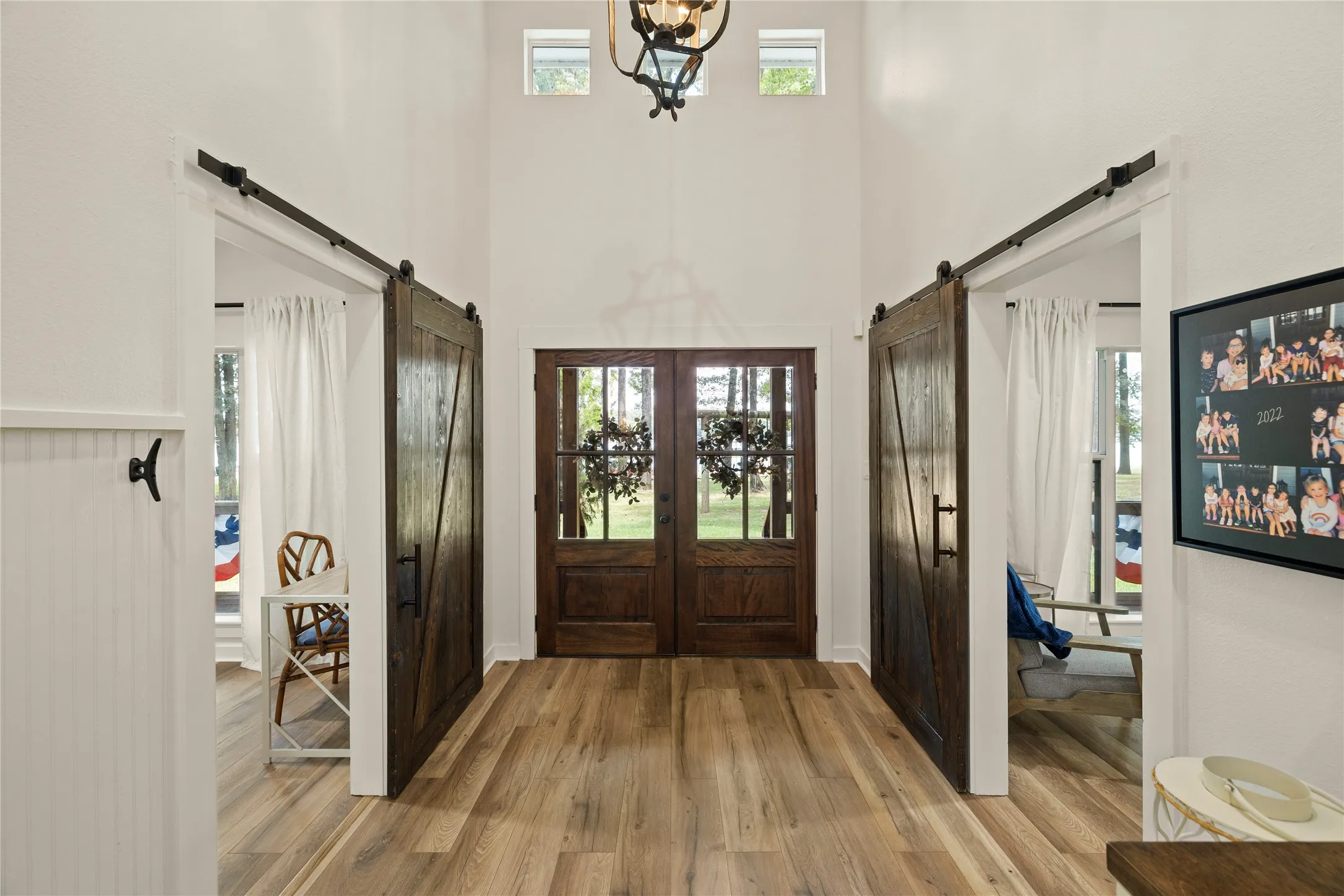 Step into a private, comfortable space where visitors can relax & recharge -- making lake weekends & extended stays even more enjoyable. Barn doors for bedroom privacy.