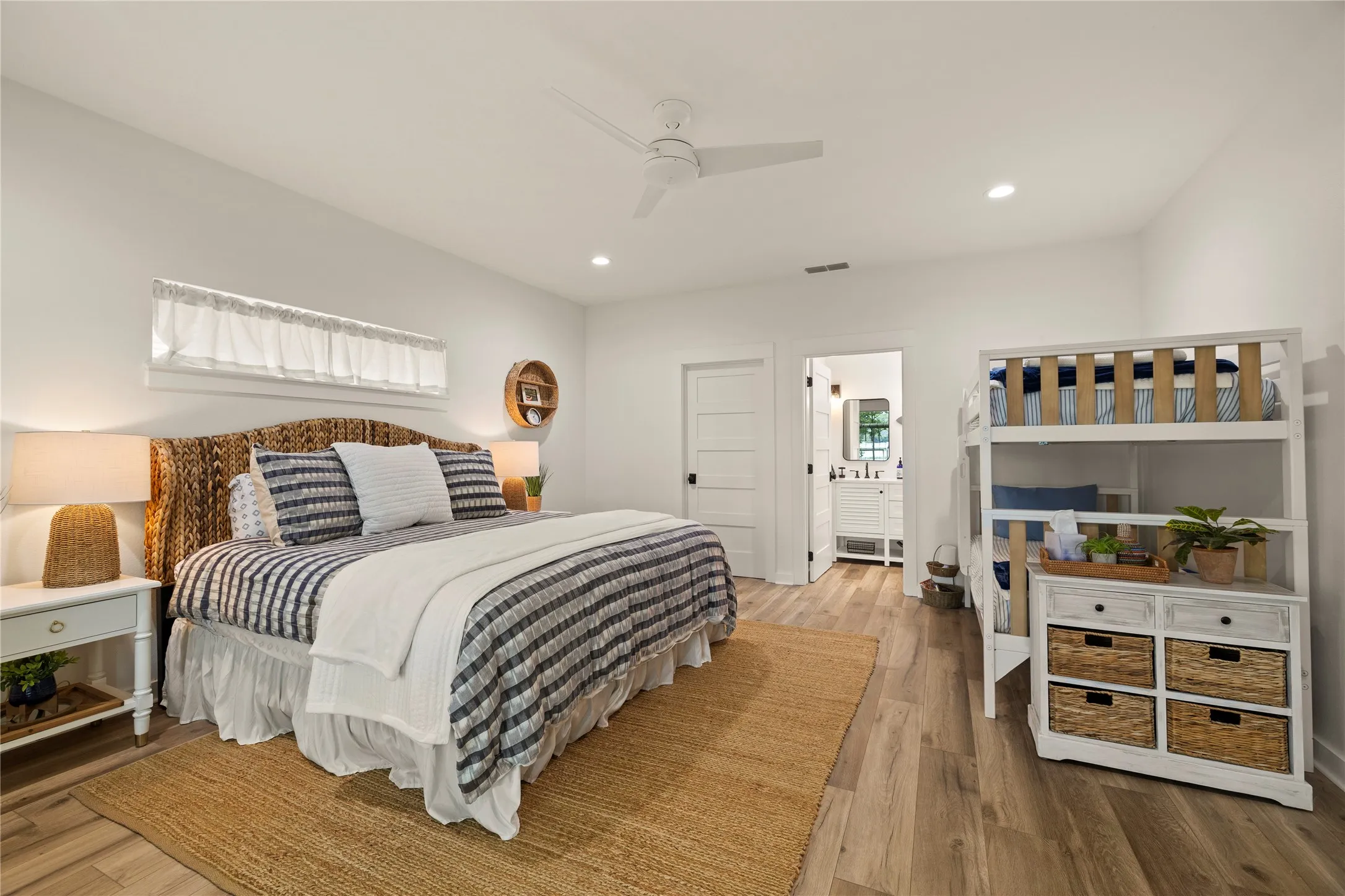 Left side 15'x18' bedroom has a deep walk-in closet + an ensuite full bathroom.  The cottage also includes furnishings...a king bed + bunk beds in this bedroom.