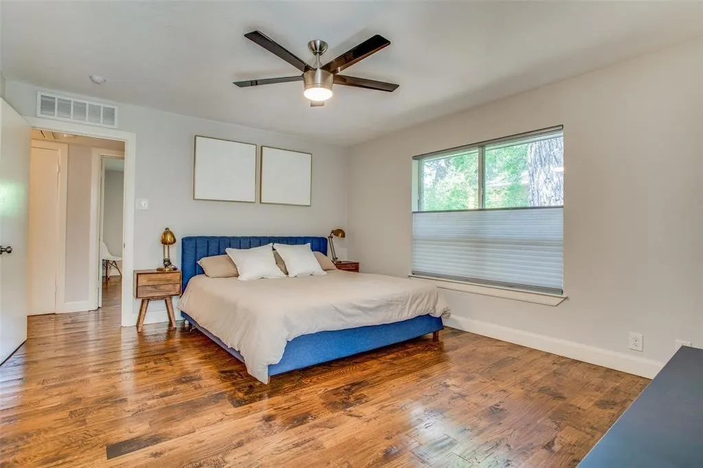 Wood-finish flooring throughout, complemented by light gray walls