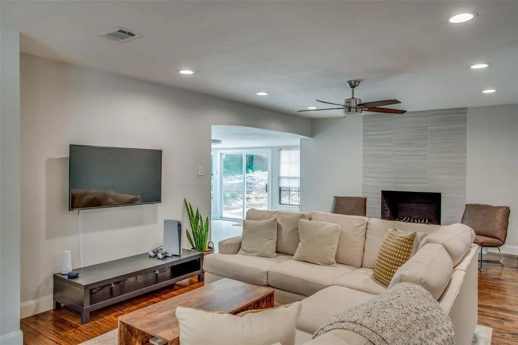 Recessed ceiling lighting, wood-finish flooring, and a ceiling fan