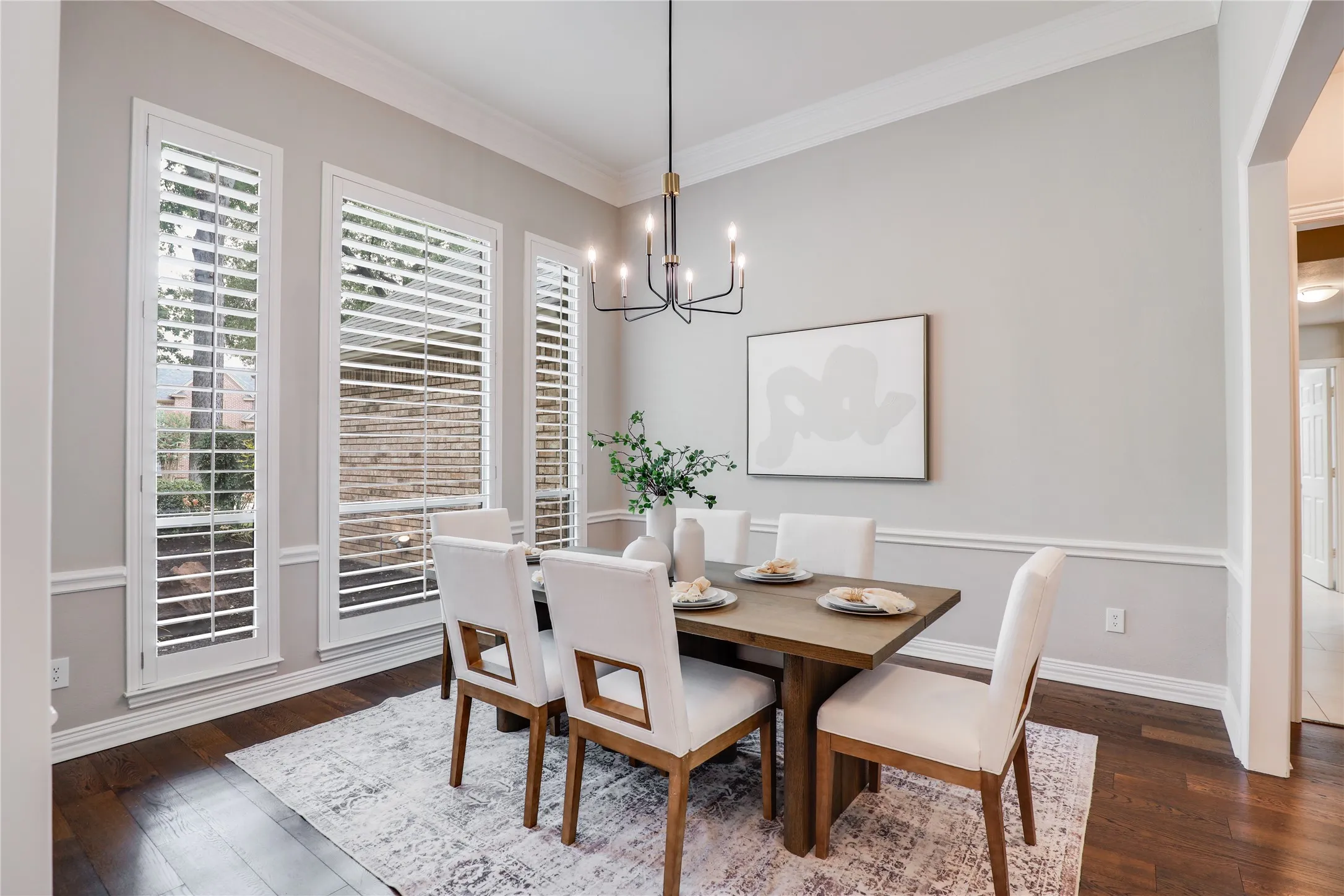formal dining room with view of plants and street