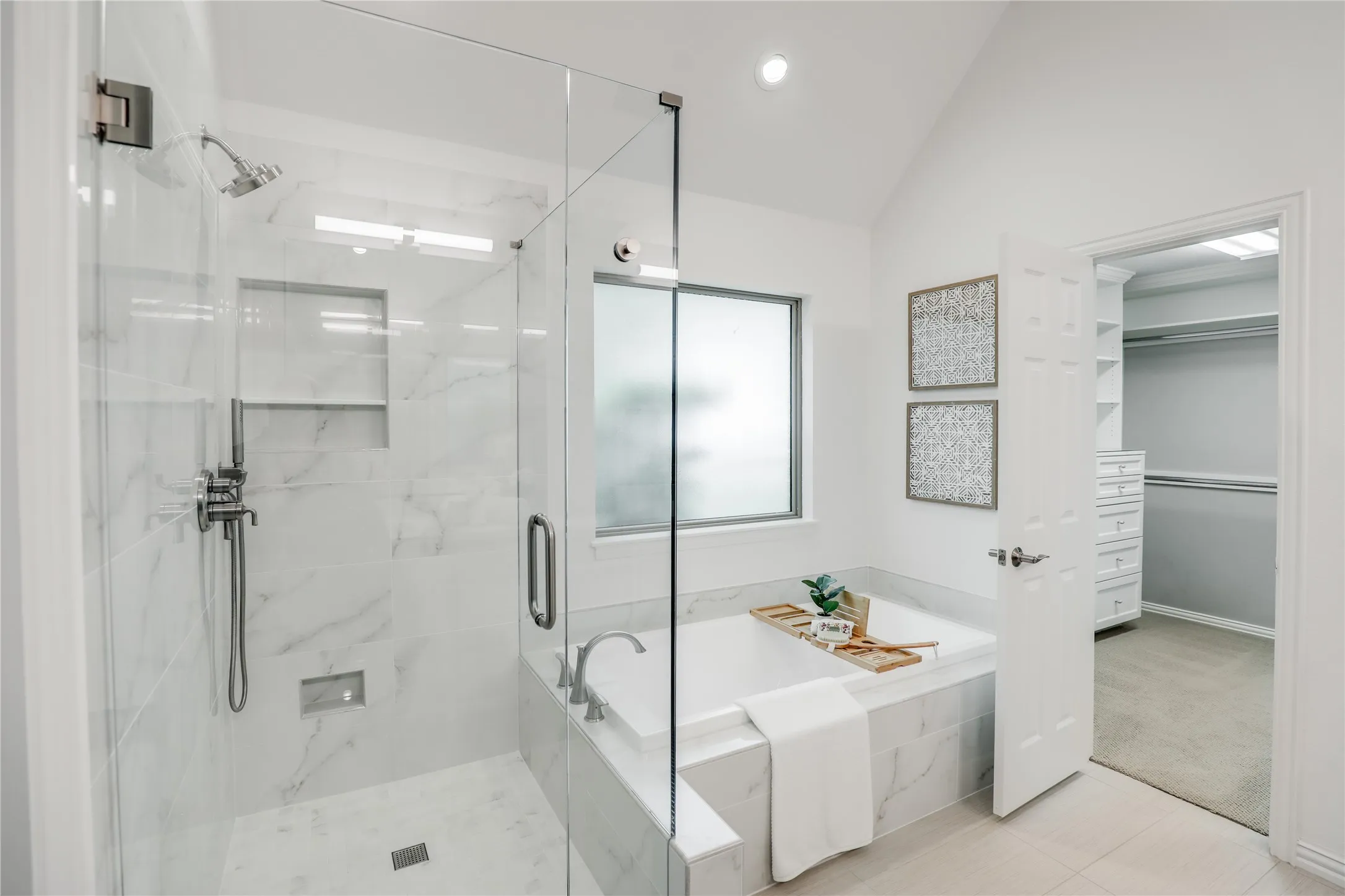 Recently renovated bathroom with separate glass shower.