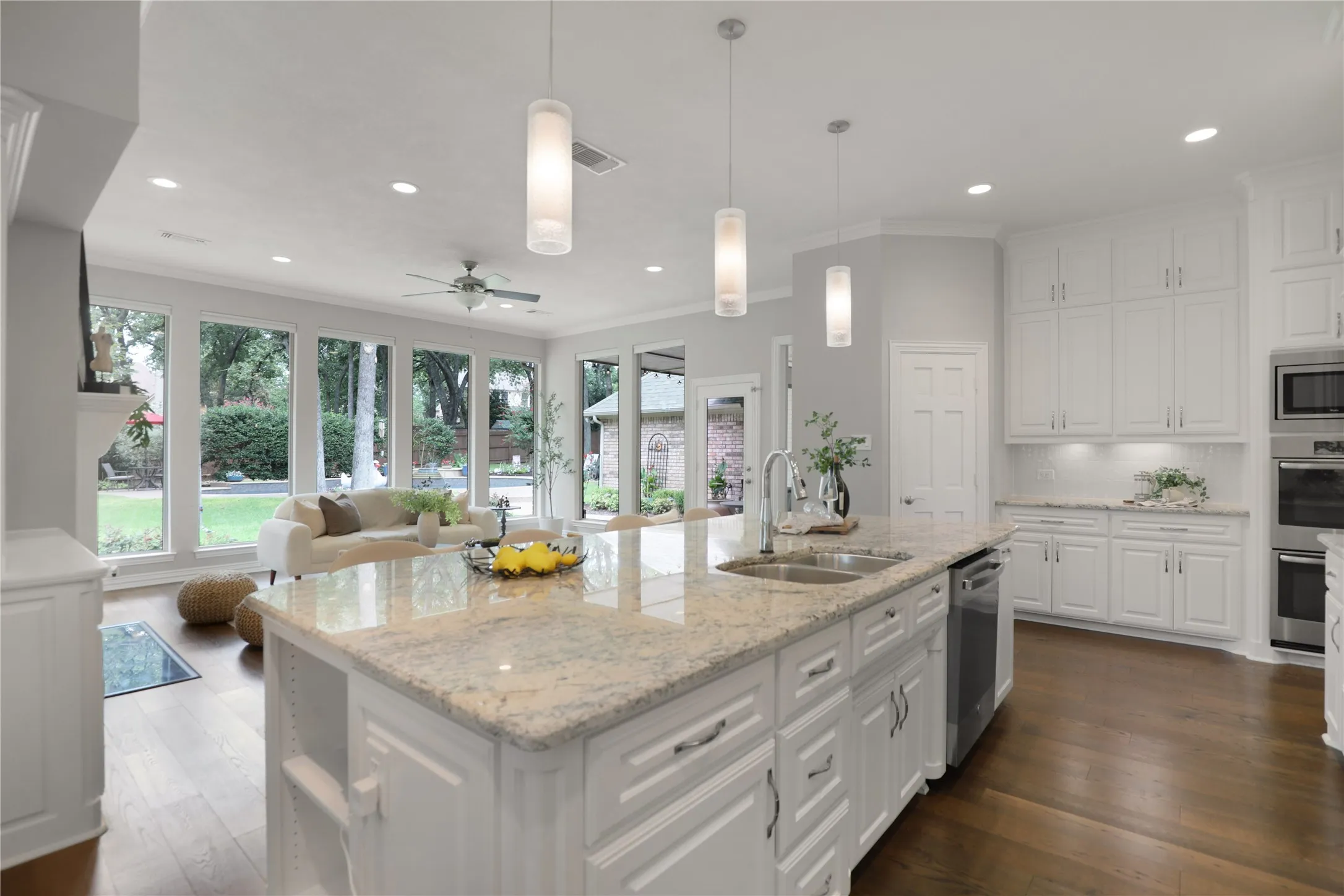 View of backyard over large kitchen island
