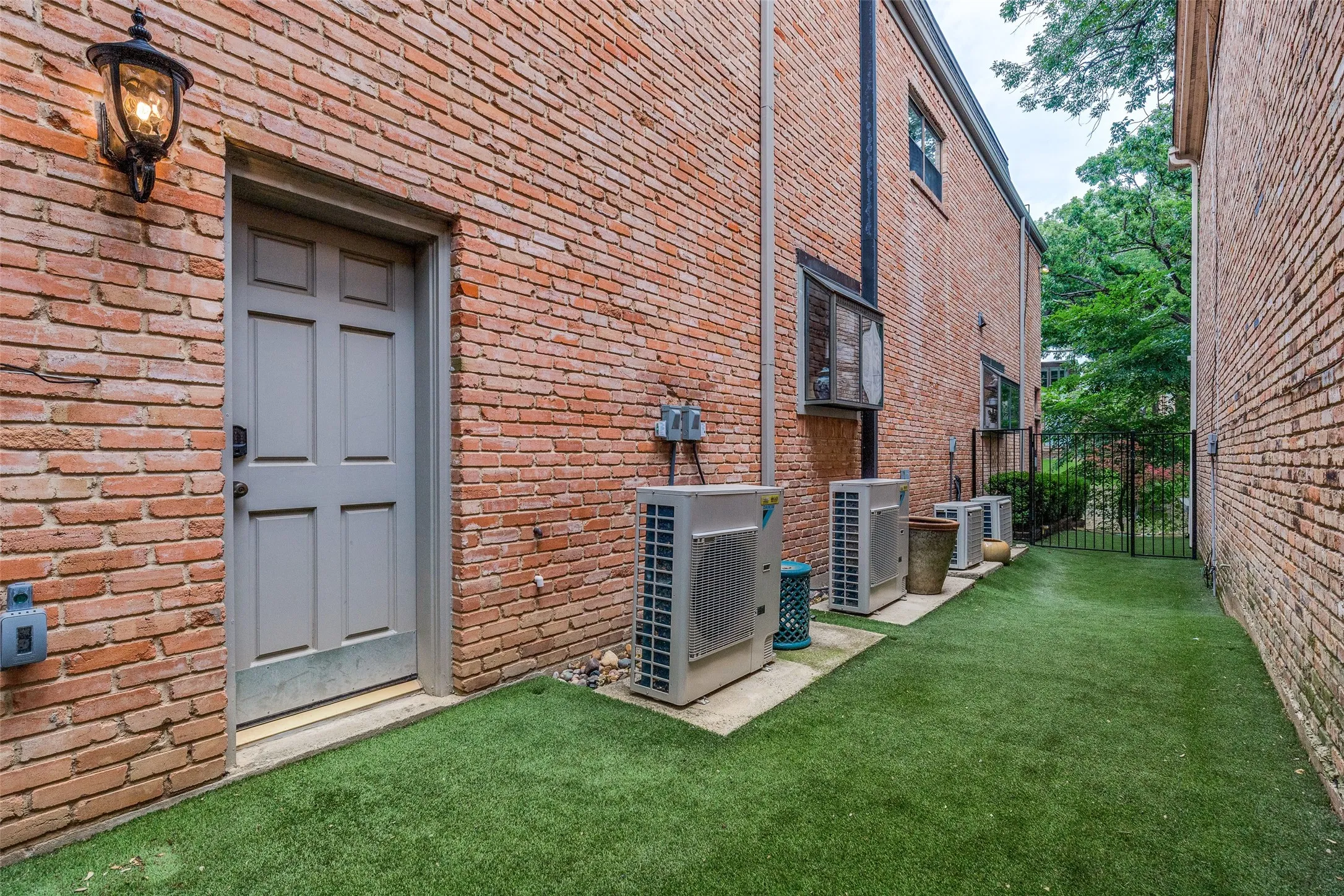 Turfed side yard off garage perfect for pets