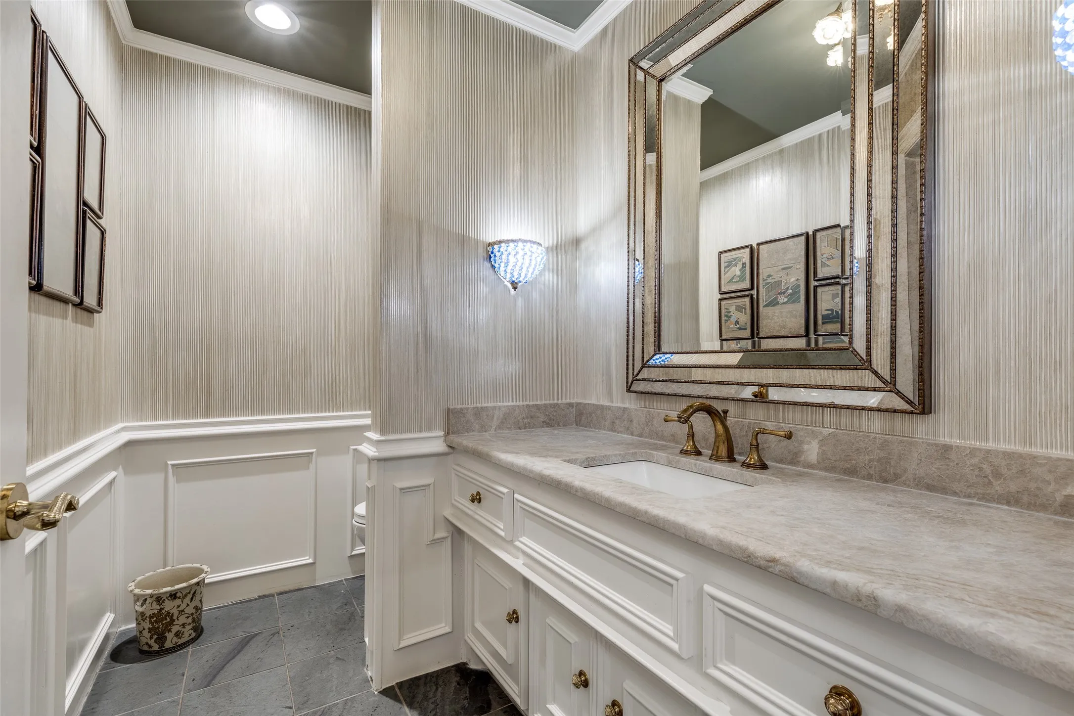 Off the foyer, one of 2 half baths.