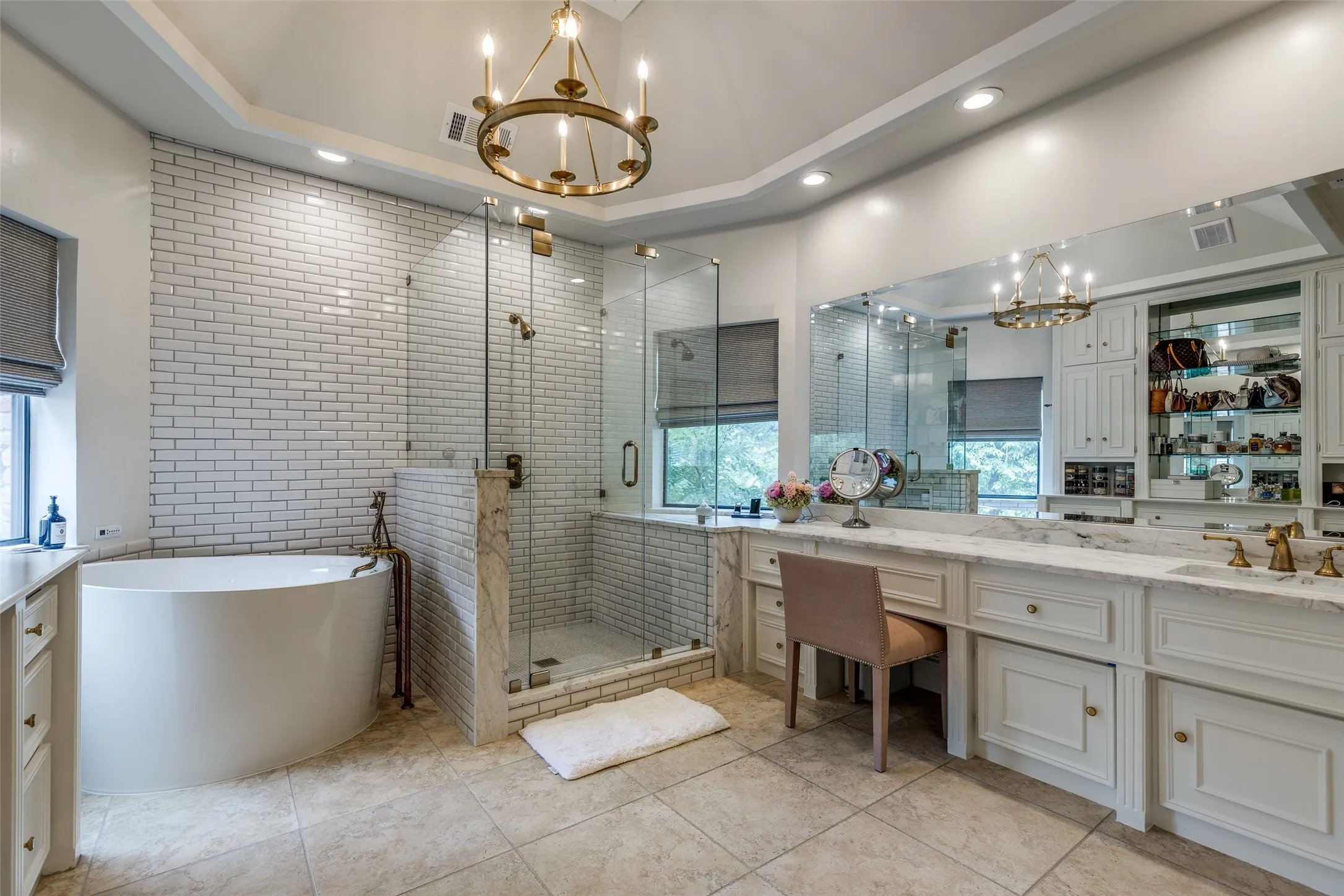 Beautifully remodeled en suite bathroom with leathered marble countertops, antique brass plumbing fixtures, decorative lighting, soaking air jet bath, and a toto toilet w bidet attachment. This leads into a private toilet room and also large walk in closet.