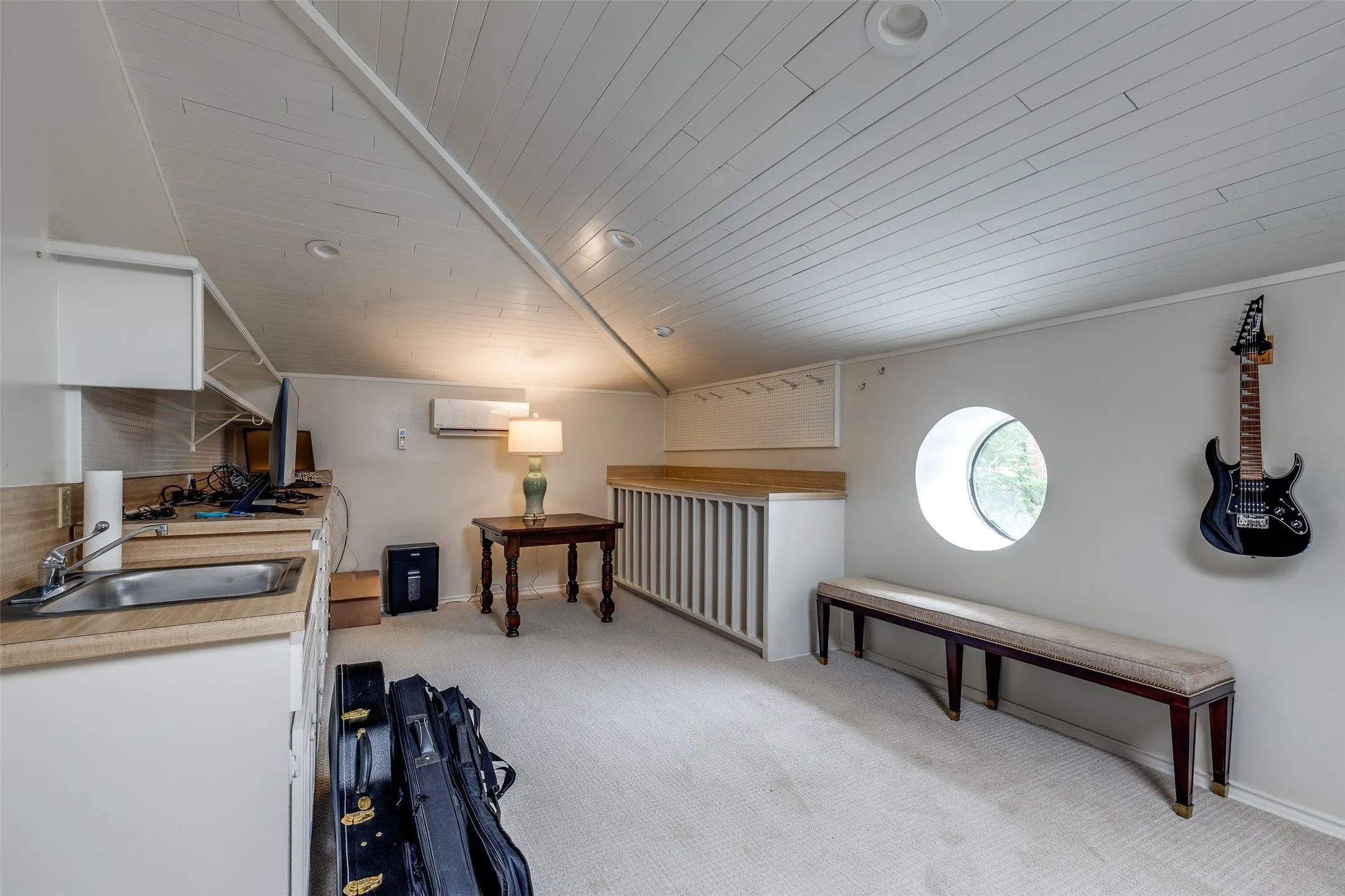 Roomy and casual flexible living space upstairs can be used a a playroom, art/music studio, or exercise room.
