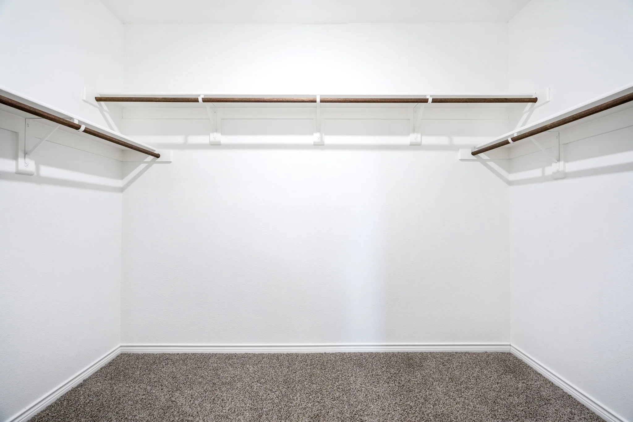 Wall-to-wall carpeting and white walls