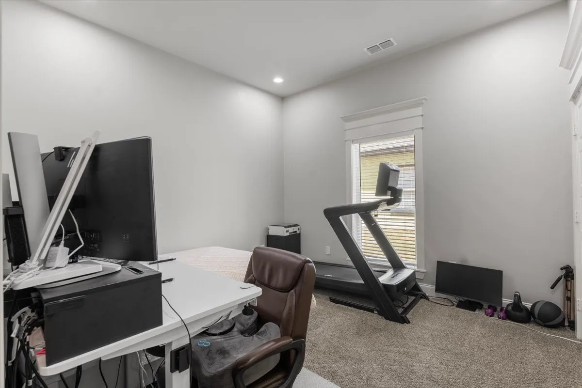 Recessed lighting, window with blinds, and carpeted flooring