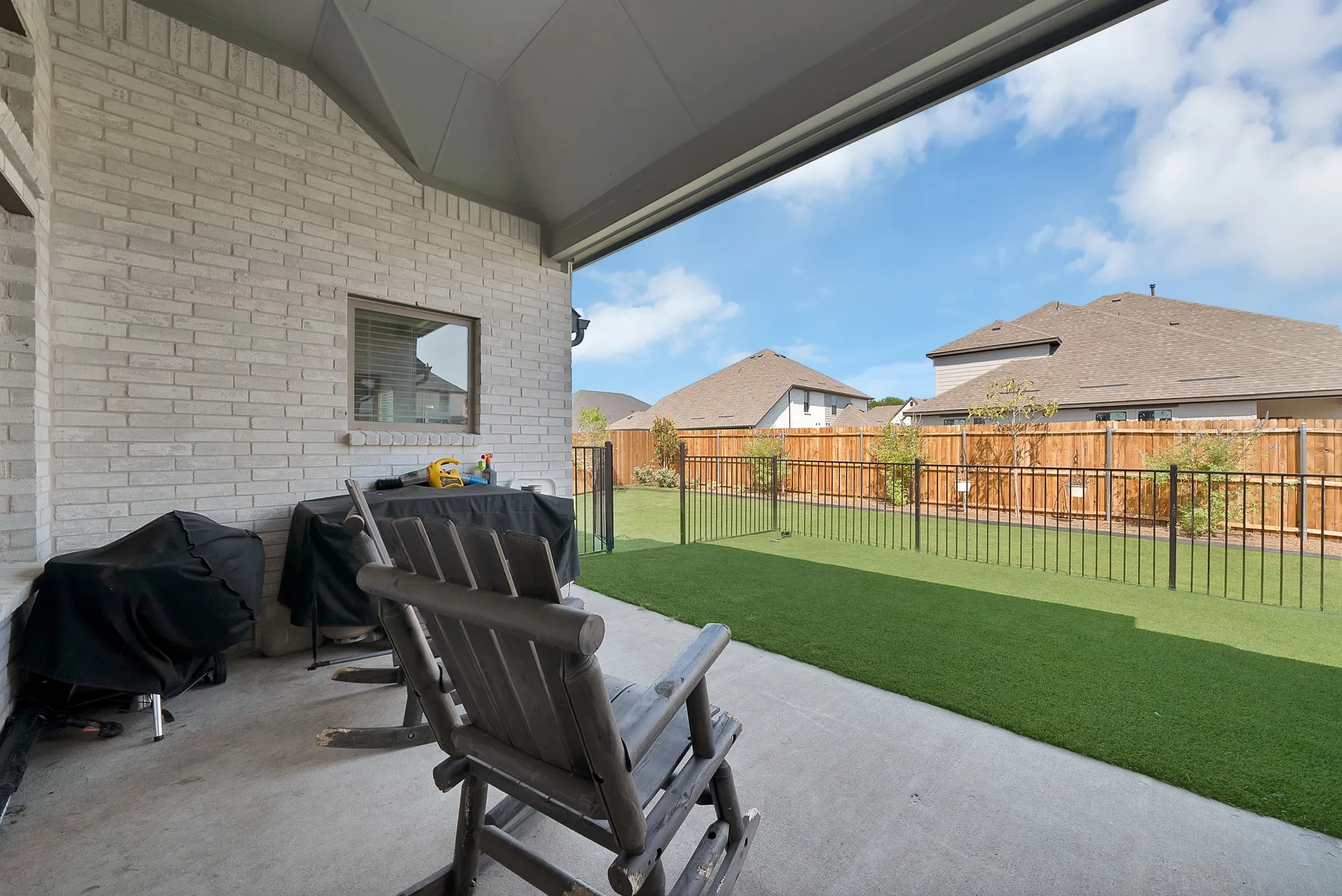 Covered patio perfect for watching the children play outside or morning coffee.