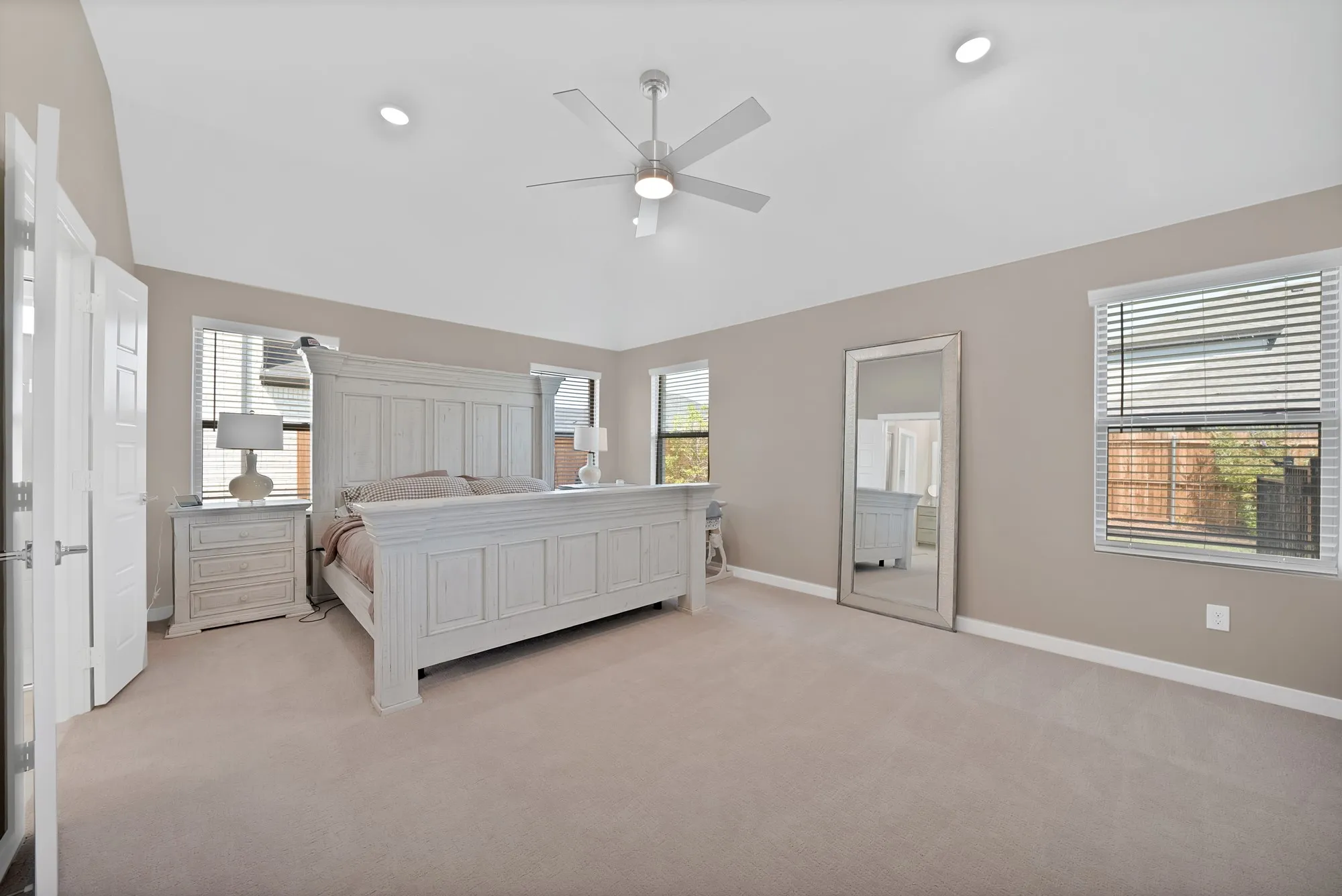 Primary bedroom with enough space for a home office or sitting area.