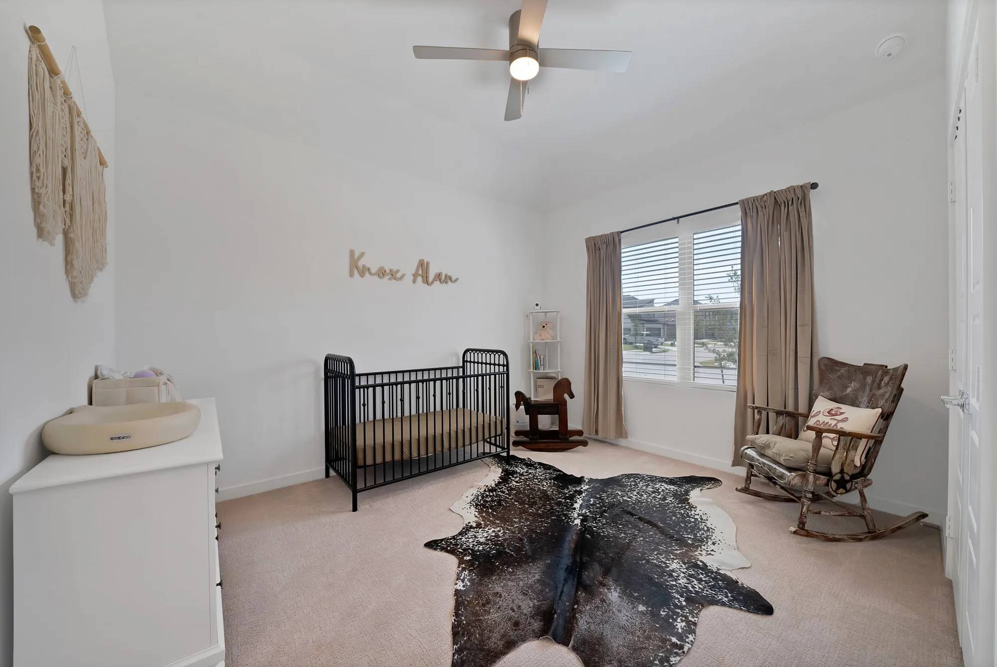 #2 - Another spacious secondary bedroom with a large window, carpet and a ceiling fan.