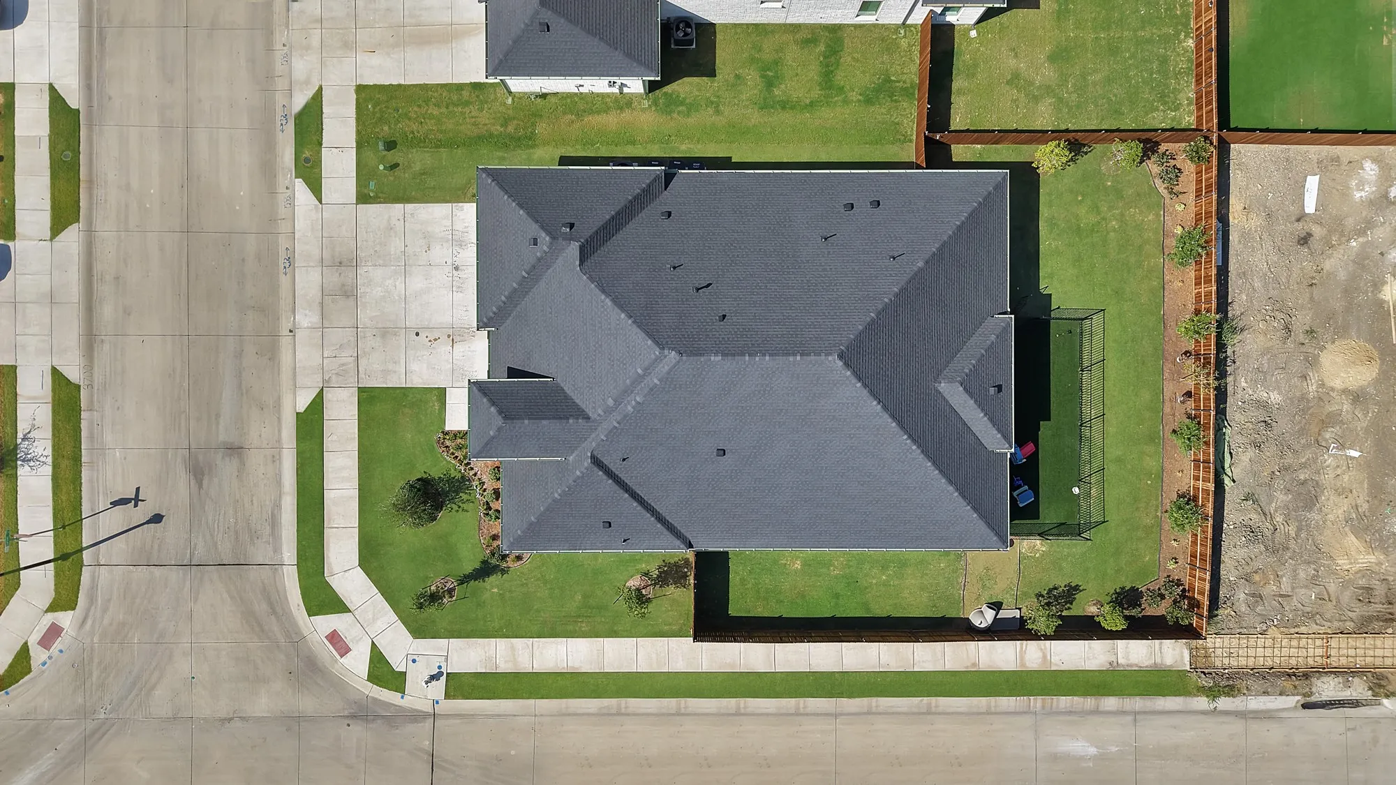 Aerial view of the property that showcases the well maintained yard.  The corner lot is a upgrade.
