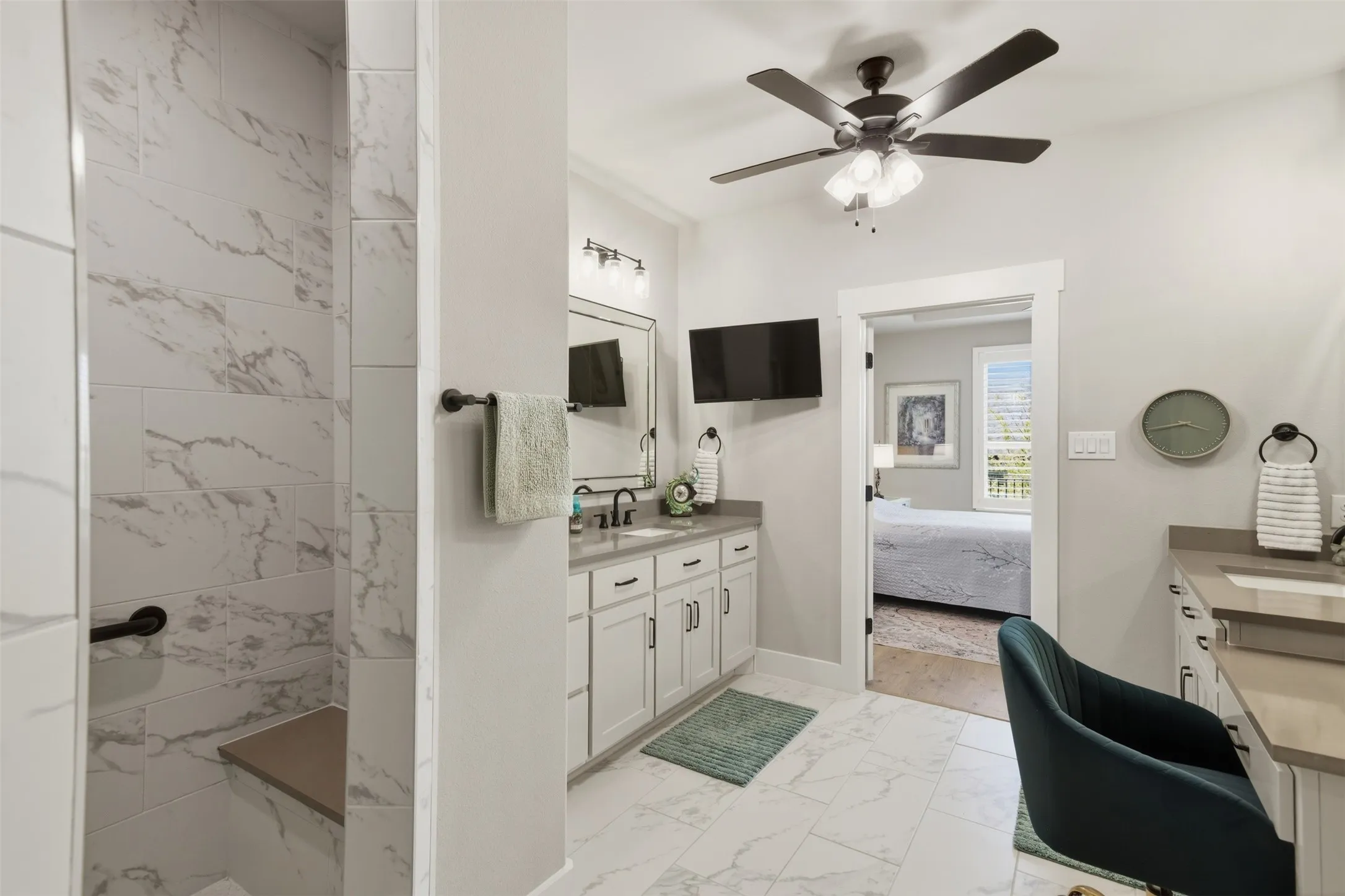 Walk-in shower with a built-in bench and large format tile