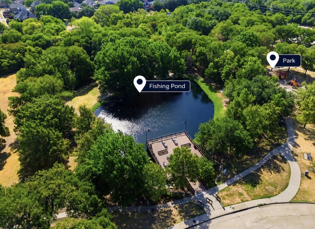Neighborhood amenities including a fishing pond with a pier and a park with play equipment