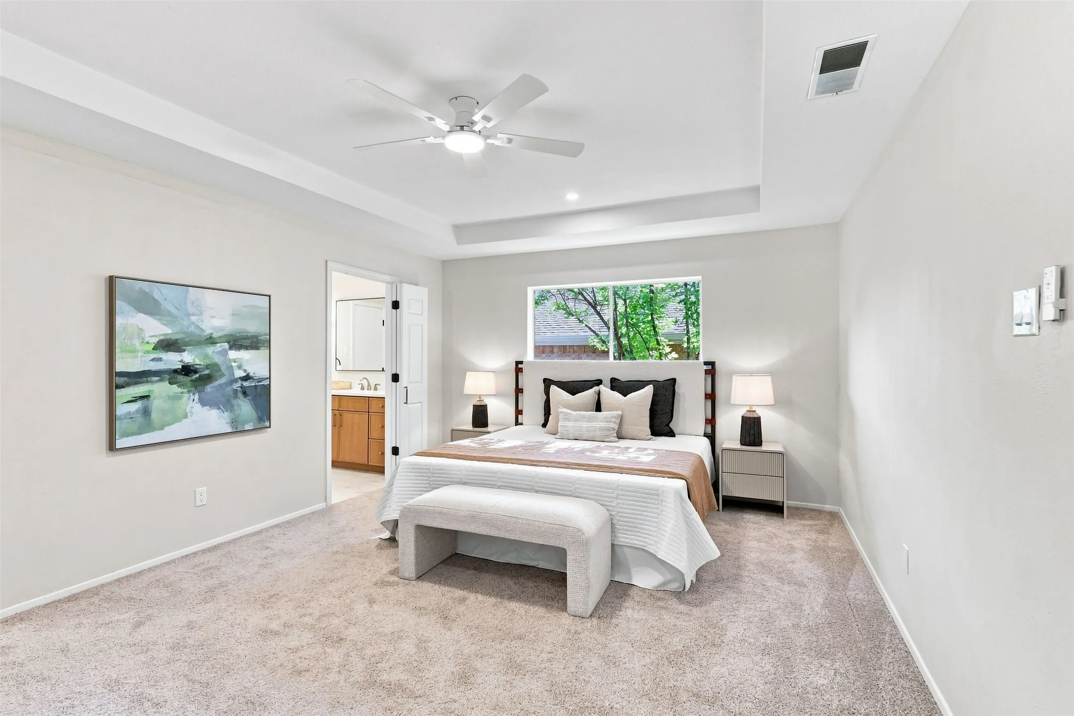 Tray ceiling with recessed lighting and a ceiling fan