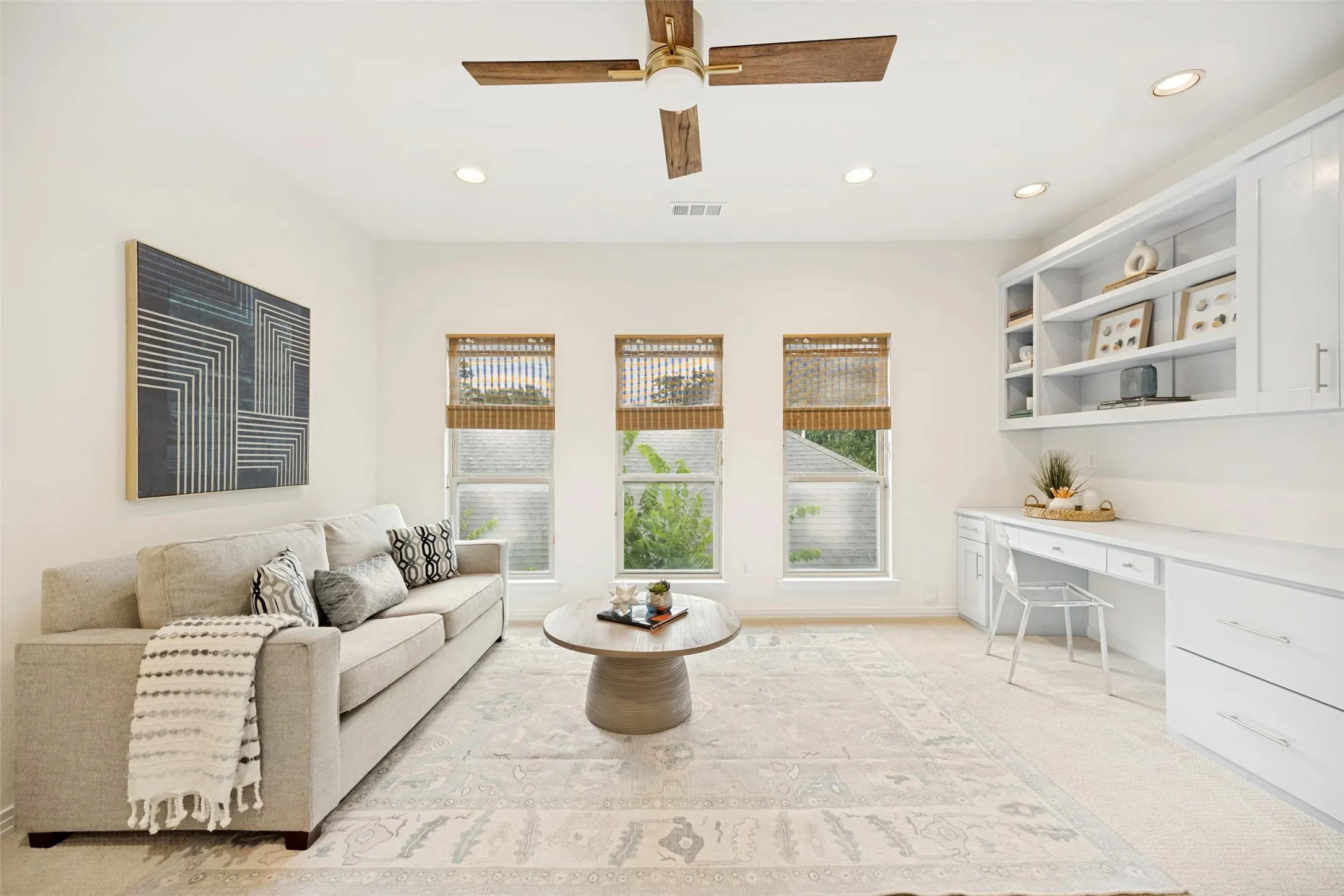 Upstairs game room or second living room with build in cabinetry
