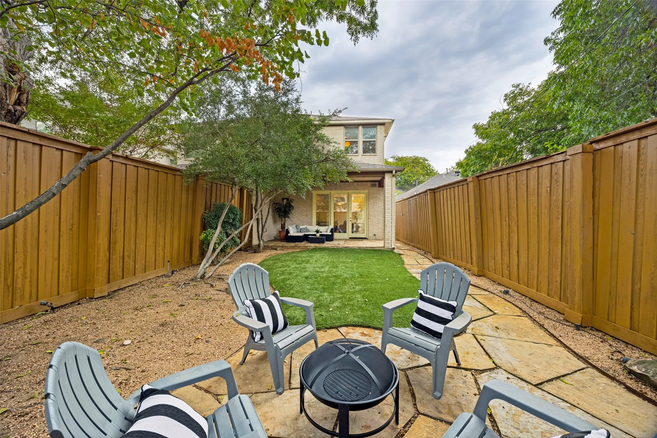 Oversized lot with artificial turf and wooden fence